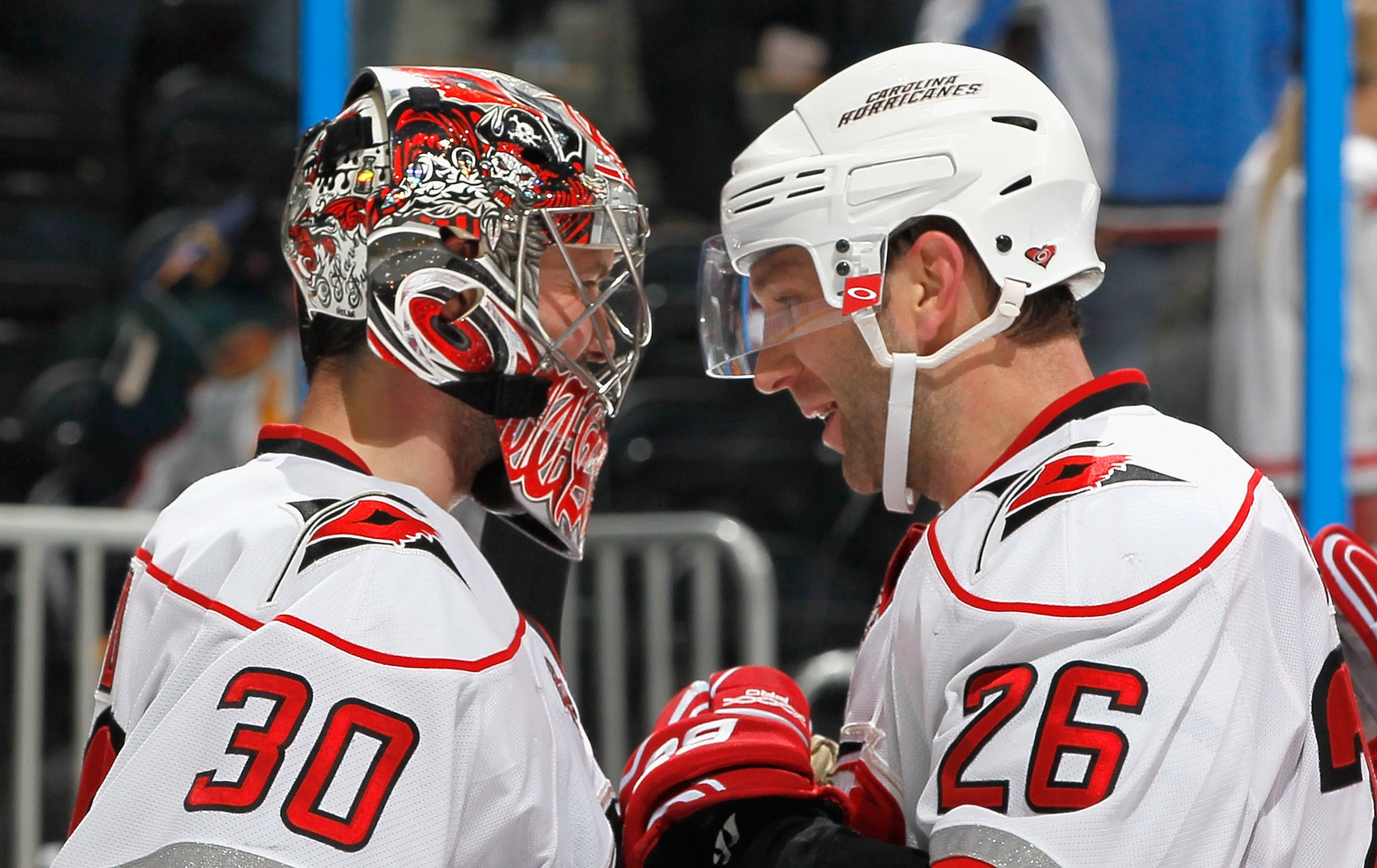 ATLANTA, GA - FEBRUARY 13:  Erik Cole #26 and goaltender Cam Ward #30 of the Carolina Hurricanes celebrate after their 3-2 win over the Atlanta Thrashers at Philips Arena on February 13, 2011 in Atlanta, Georgia.  Cole scored the game-winning goal in the