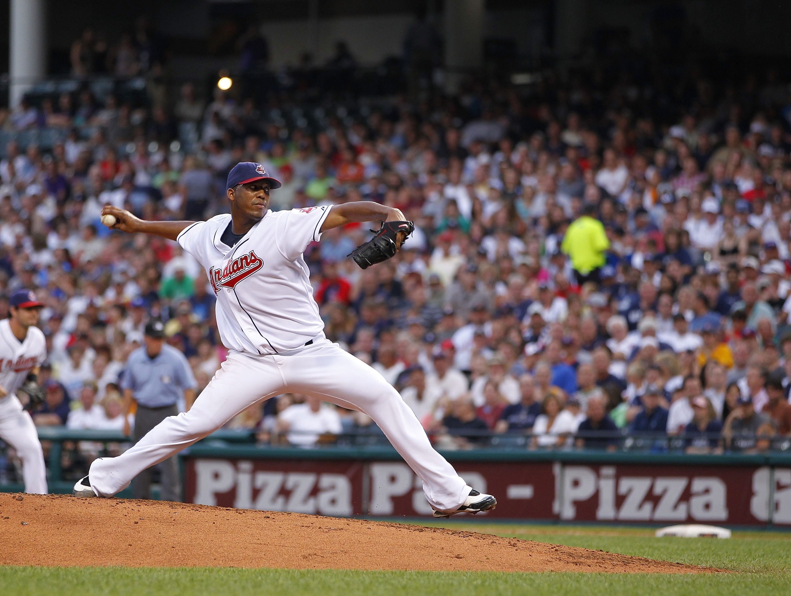 CLEVELAND - JULY 28:  Fausto Carmona #55 of the Cleveland Indians throws a second inning pitch while playing the New York Yankees on July 28, 2010 at Progressive Field in Cleveland, Ohio.  (Photo by Gregory Shamus/Getty Images)