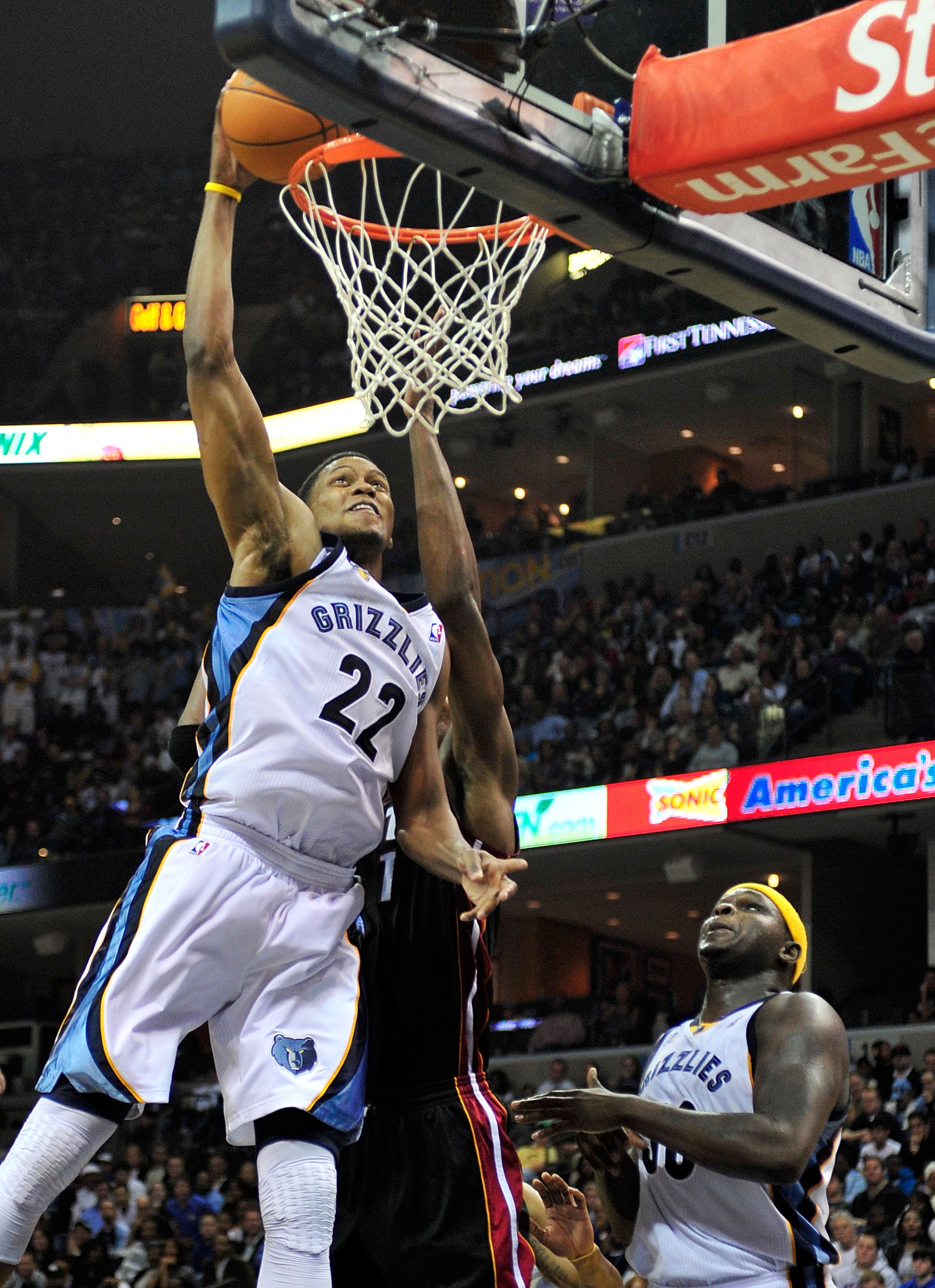 MEMPHIS, TN - NOVEMBER 20:  Rudy Gay #22 of the Memphis Grizzlies dunks over Chris Bosh #1 of the Miami Heat at FedExForum on November 20, 2010 in Memphis, Tennessee. The Grizzlies won 97-95. NOTE TO USER:  User expressly acknowledges and agrees that, by