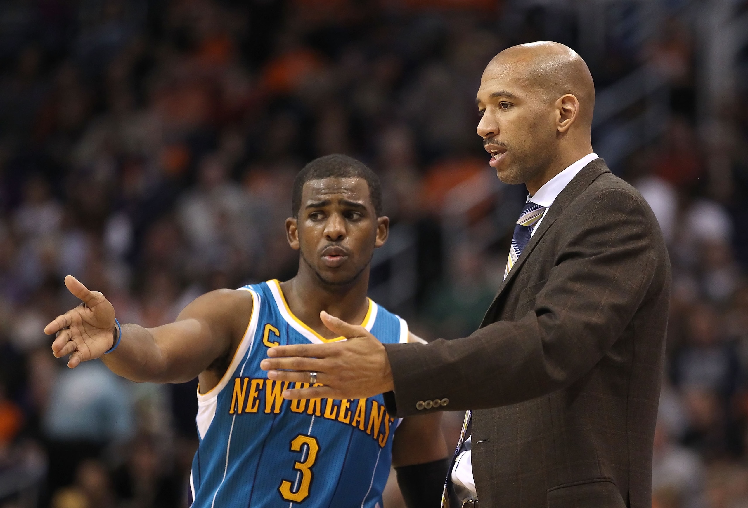 PHOENIX, AZ - JANUARY 30:  Chris Paul #3 of the New Orleans Hornets talks with head coach Monty Williams during the NBA game against the Phoenix Suns at US Airways Center on January 30, 2011 in Phoenix, Arizona. The Suns defeated the Hornets 104-102. NOTE