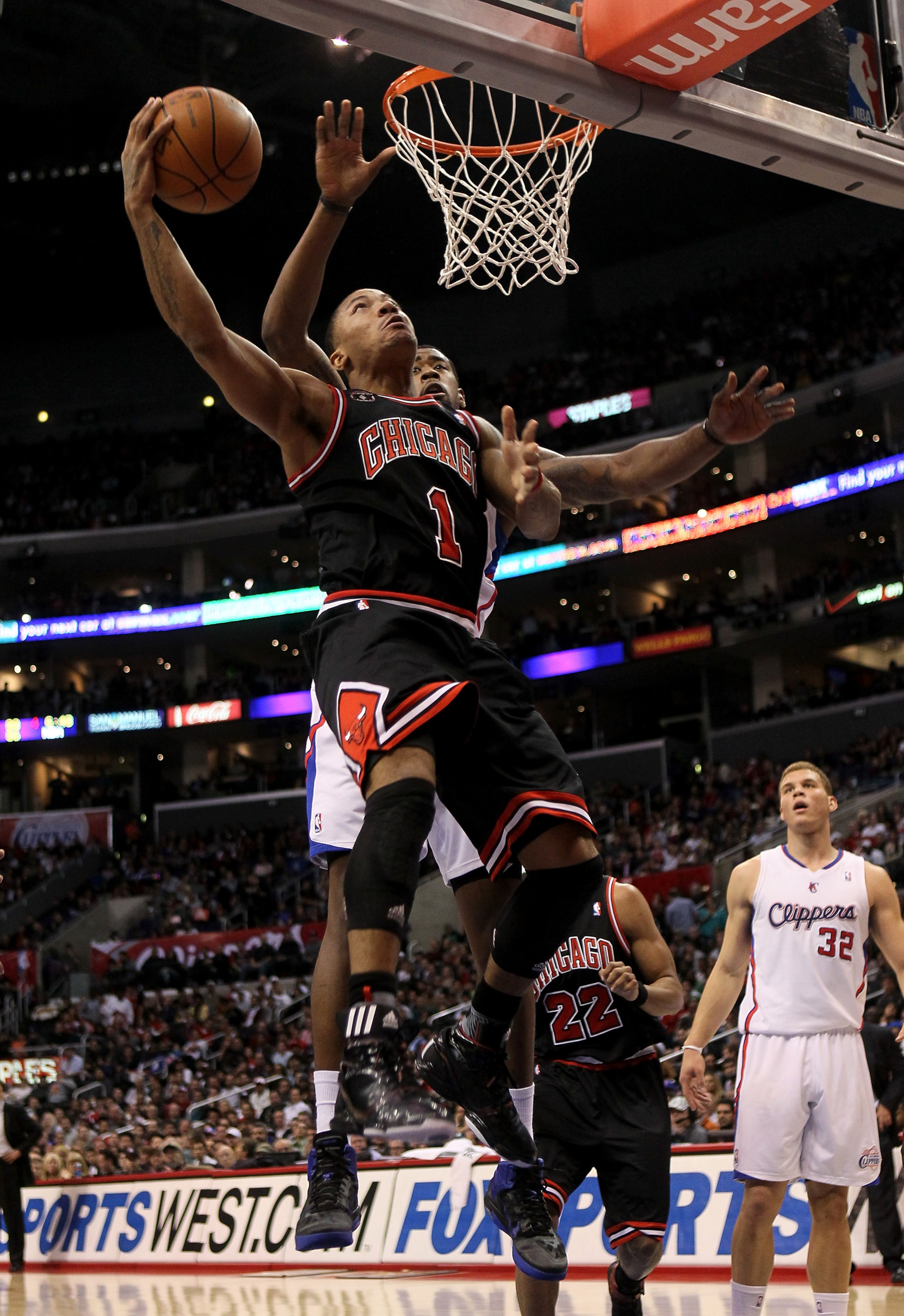 LOS ANGELES, CA - FEBRUARY 2:  Derrick Rose #1 of the Chicago Bulls goes up for a basket over DeAndre Jordan #19 of the Los Angeles Clippers at Staples Center on February 2, 2011  in Los Angeles, California.  NOTE TO USER: User expressly acknowledges and