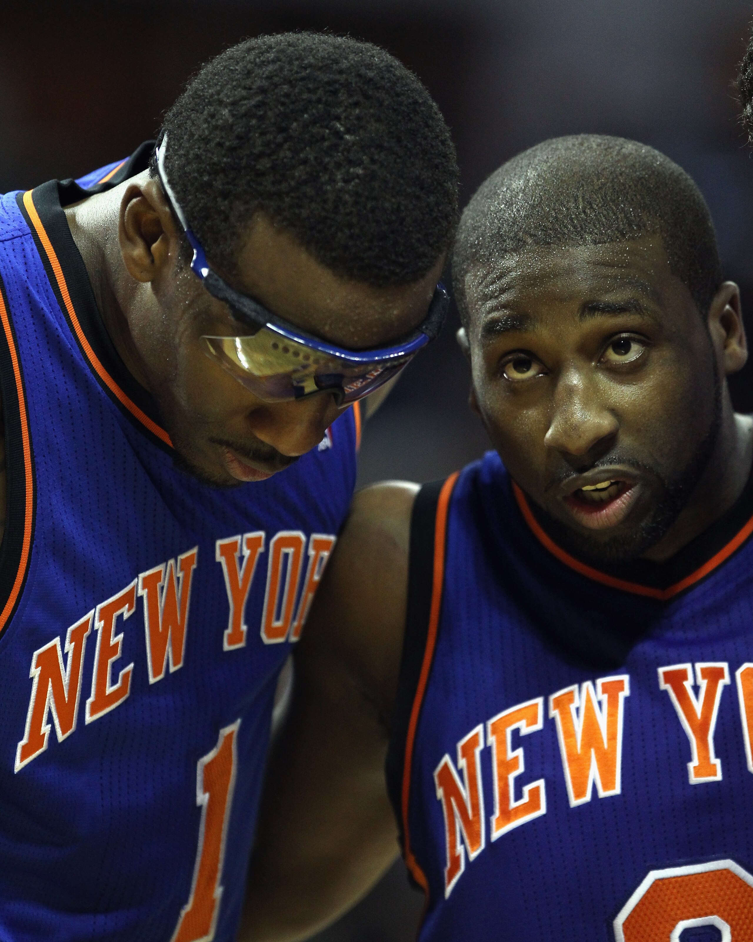CHARLOTTE, NC - NOVEMBER 24:  Amare Stoudemire #1 of the New York Knicks and teammate Raymond Felton #2 huddle up against the Charlotte Bobcats at Time Warner Cable Arena on November 24, 2010 in Charlotte, North Carolina.  NOTE TO USER: User expressly ack