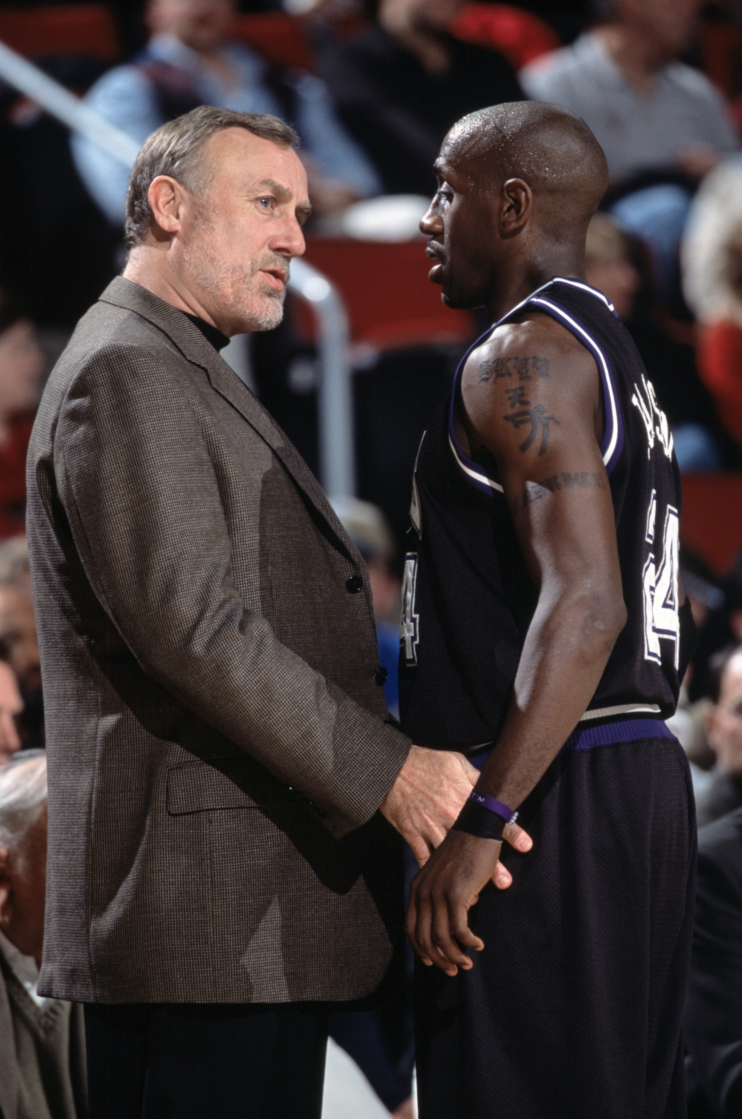 19 Dec 2001:  Guard Bobby Jackson #24 of the Sacramento Kings listens to head coach Rick Adelman during the NBA game against the Seattle SuperSonics at Key Arena in Seattle, Washington.  The SuperSonics defeated the Kings 104-92.Mandatory Credit:  Otto Gr
