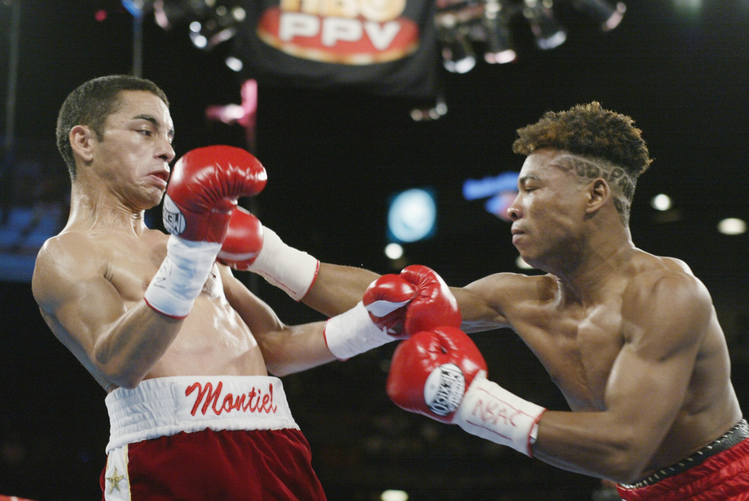 LAS VEGAS - JUNE 22:  Fernando Montiel (L) weaves back  to avoid a blow by Pedro Alcazar in their WBO Super Flyweight Championship fight on June 22, 2002 at the MGM Grand in Las Vegas, Nevada.  Montiel won with a sixth round technical knockout.  Alcazar c