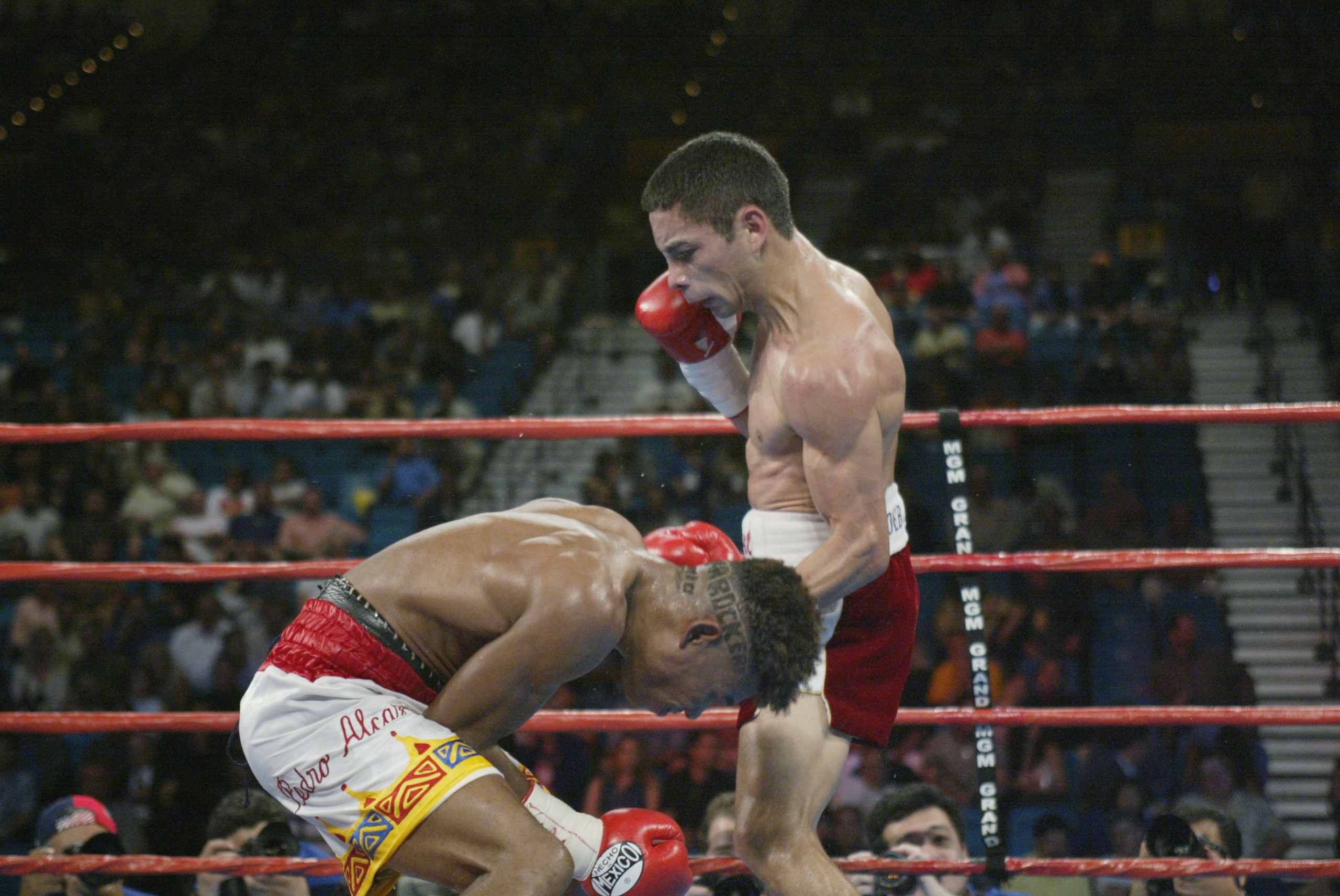 LAS VEGAS - JUNE 22:  Fernando Montiel (R) hovers over a defenseless  Pedro Alcazar in their WBO Super Flyweight Championship fight on June 22, 2002 at the MGM Grand in Las Vegas, Nevada.  Montiel won with a sixth round technical knockout.  Alcazar collap