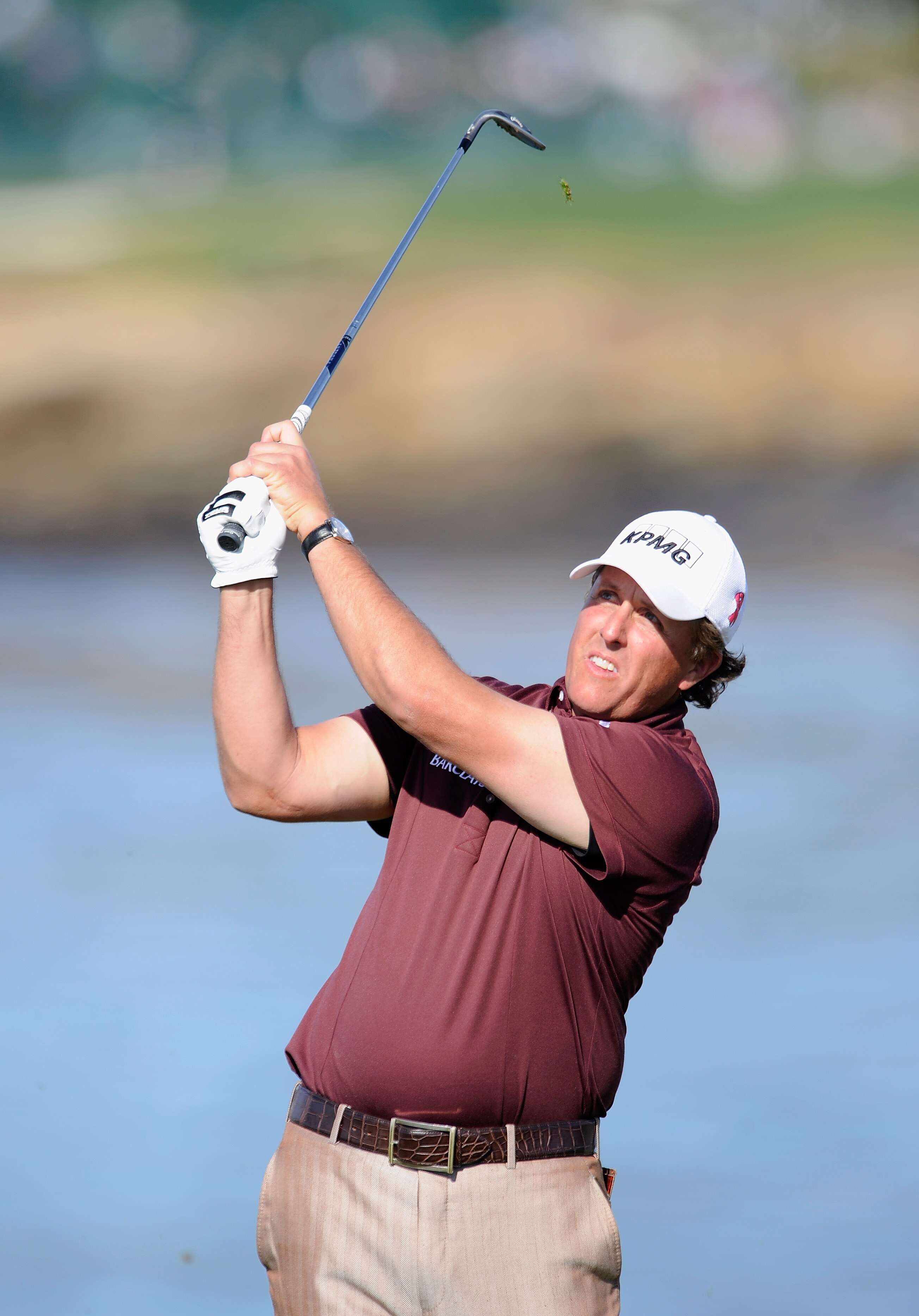 PEBBLE BEACH, CA - FEBRUARY 13:  Phil Mickelson plays his tee shot on the seventh hole during the final round of the AT&T Pebble Beach National Pro-Am at Pebble Beach Golf Links on February 13, 2011  in Pebble Beach, California.  (Photo by Stuart Franklin