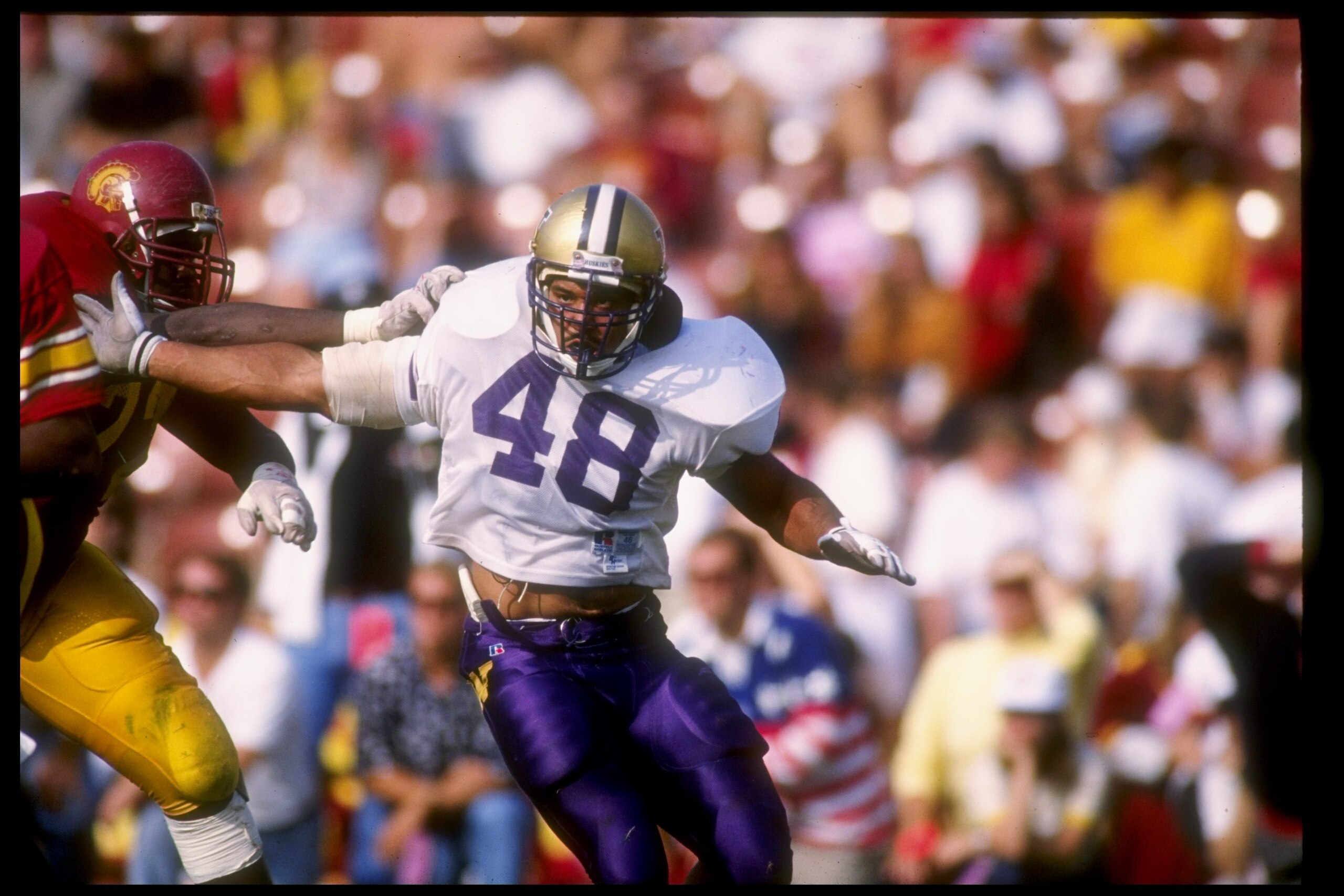 9 Nov 1991: Linebacker Donald Jones of the Washington Huskies tries to break through the line during a game against the Southern California Trojans at the Los Angeles Memorial Coliseum in Los Angeles, California. Washington won the game 14-3.