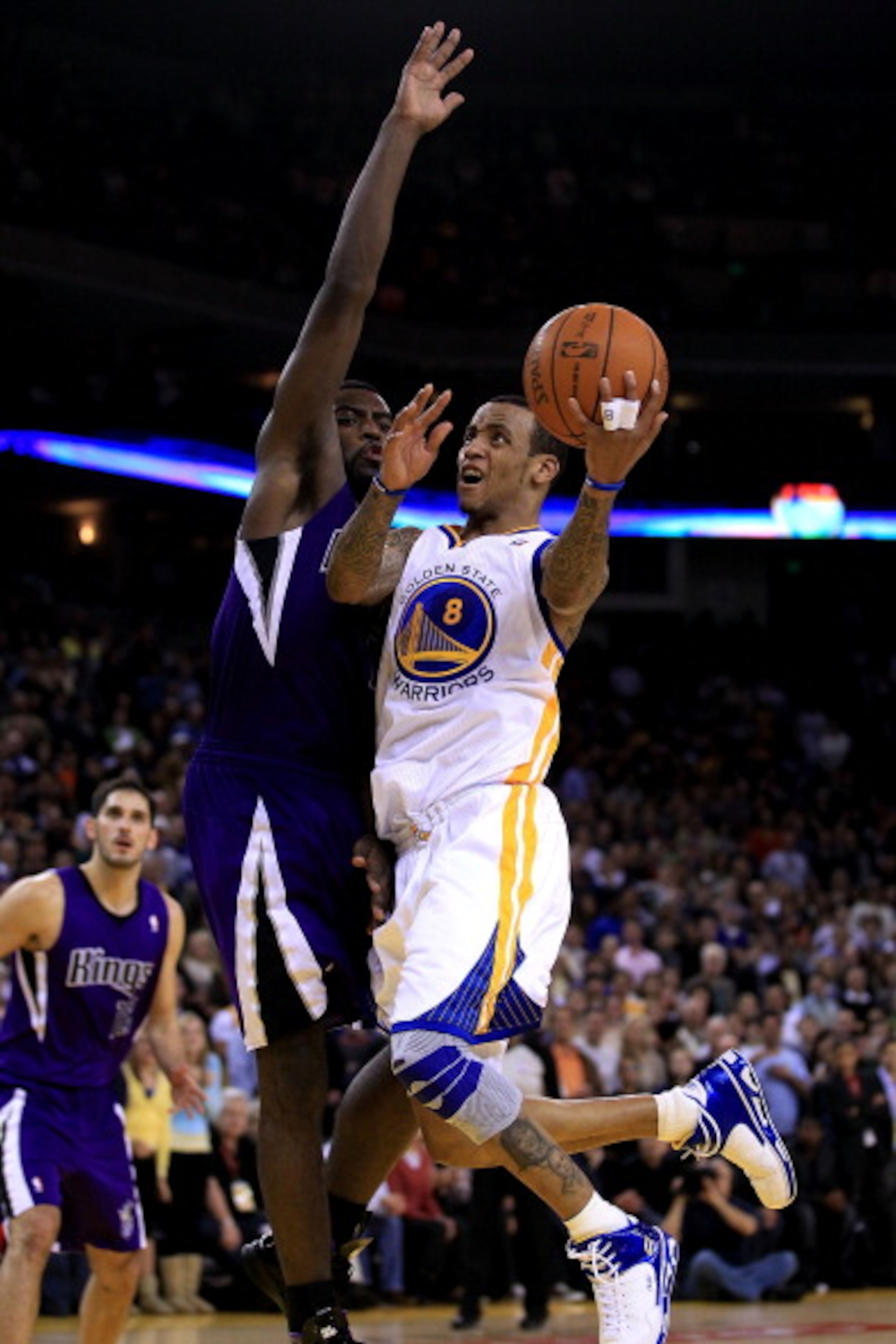 OAKLAND, CA - JANUARY 21:  Monta Ellis #8 of the Golden State Warriors shoots over Tyreke Evans #13 of the Sacramento Kings at Oracle Arena on January 21, 2011 in Oakland, California. NOTE TO USER: User expressly acknowledges and agrees that, by downloadi