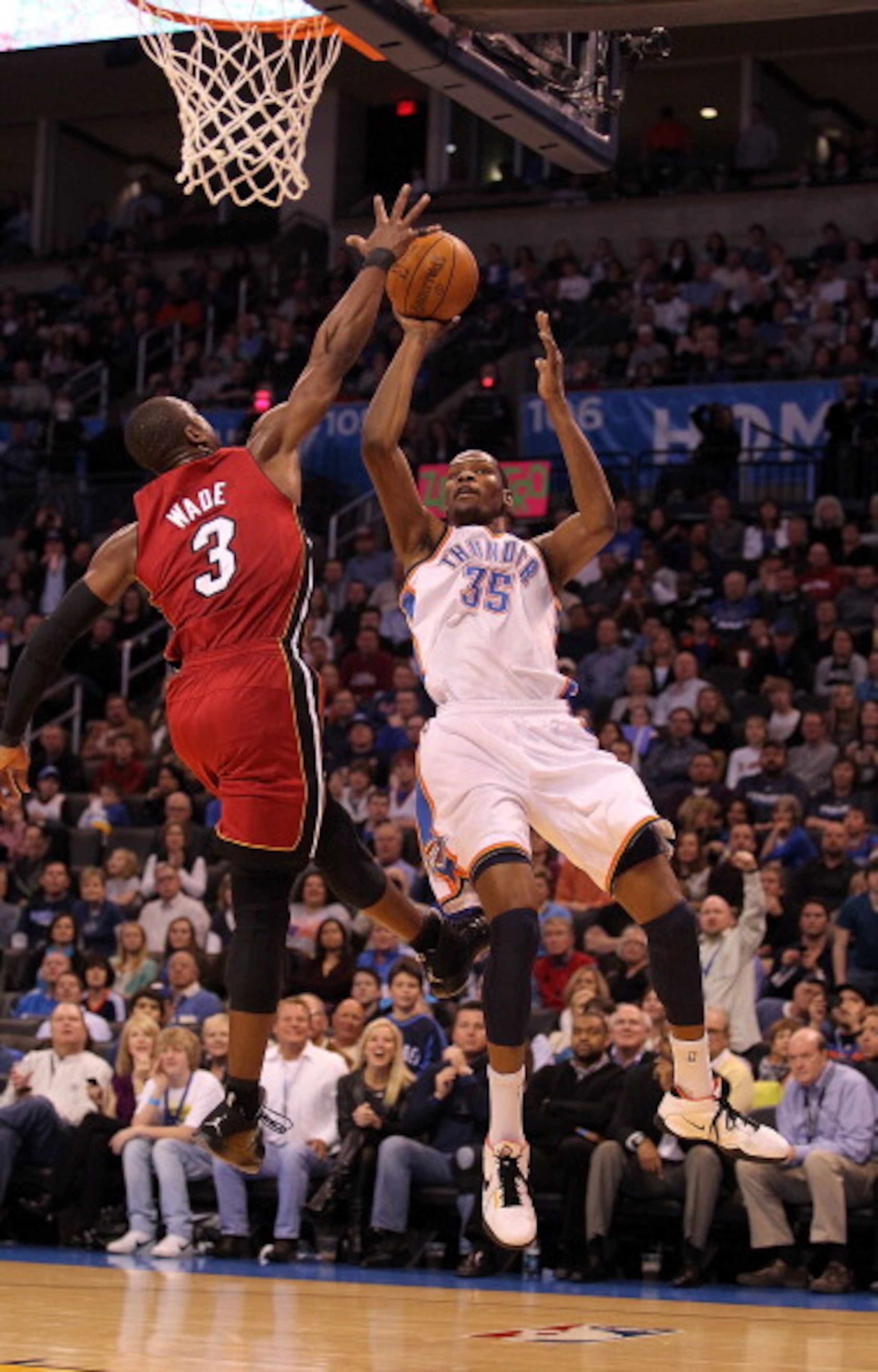 OKLAHOMA CITY, OK - JANUARY 30:  Forward Kevin Durant #35 of the Oklahoma City Thunder takes a shot against Dwyane Wade #3 of the Miami Heat at Ford Center on January 30, 2011 in Oklahoma City, Oklahoma.  NOTE TO USER: User expressly acknowledges and agre