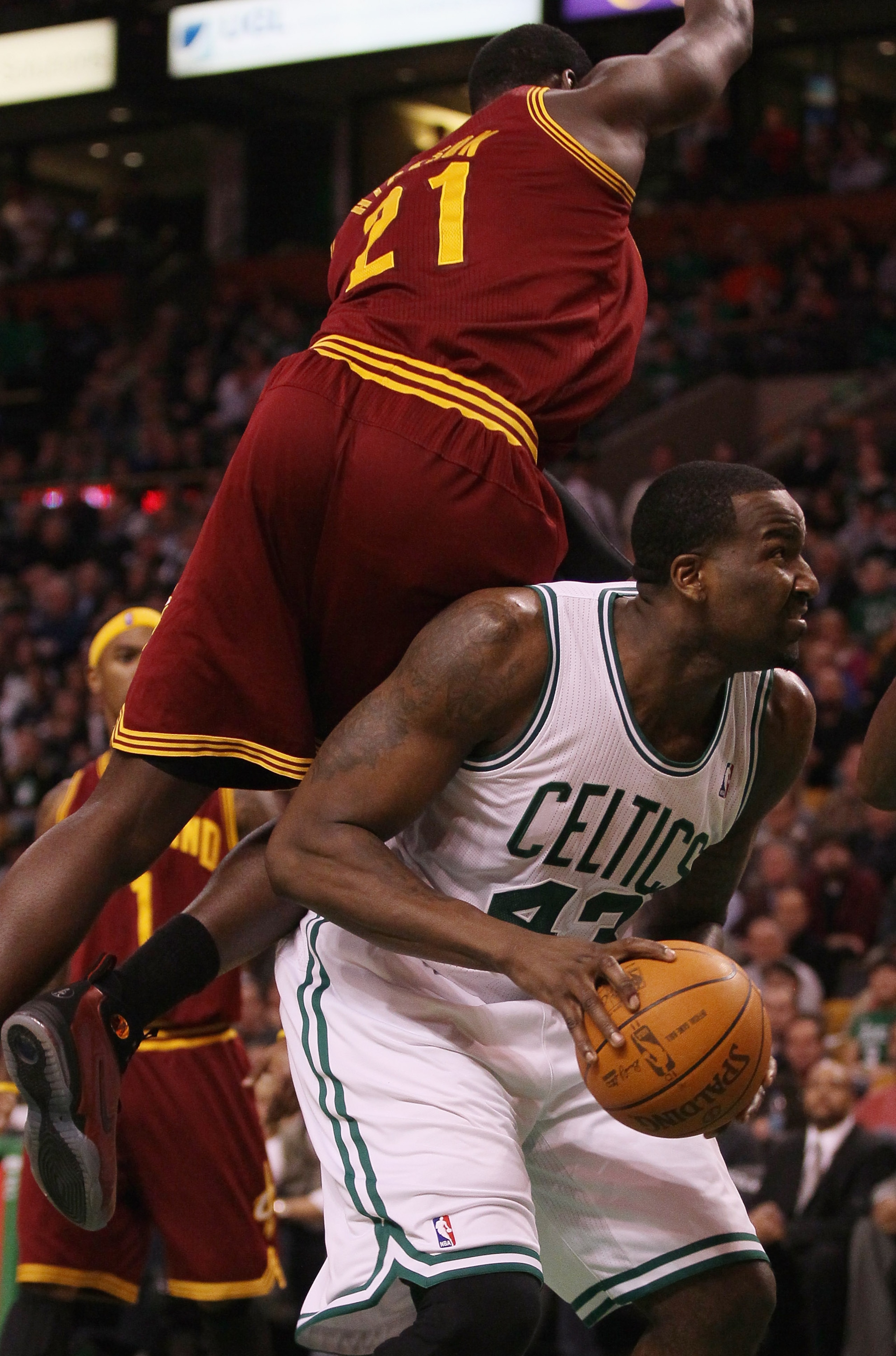 BOSTON, MA - JANUARY 25:  Kendrick Perkins #43 of the Boston Celtics is fouled by J.J. Hickson #21 of the Cleveland Cavaliers on January 25, 2011 at the TD Garden in Boston, Massachusetts. The Celtics defeated the Cavaliers 112-95.  NOTE TO USER: User exp