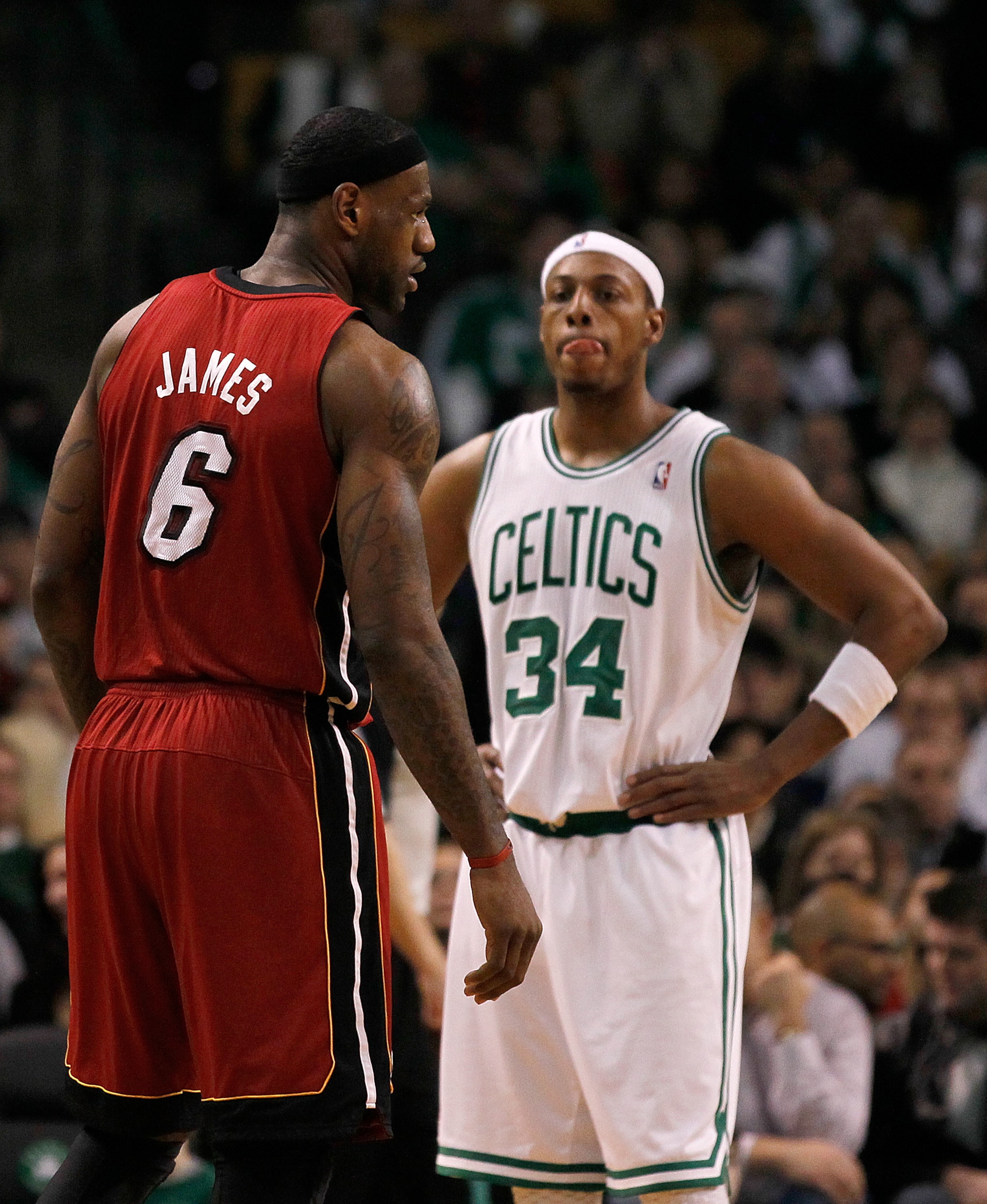 BOSTON - FEBRUARY 13:  LeBron James #6 of the Miami Heat and Paul Pierce #34 of the Boston Celtics take a breather at TD Garden on February 13, 2011 in Boston, Massachusetts. NOTE TO USER: User expressly acknowledges and agrees that, by downloading and/or