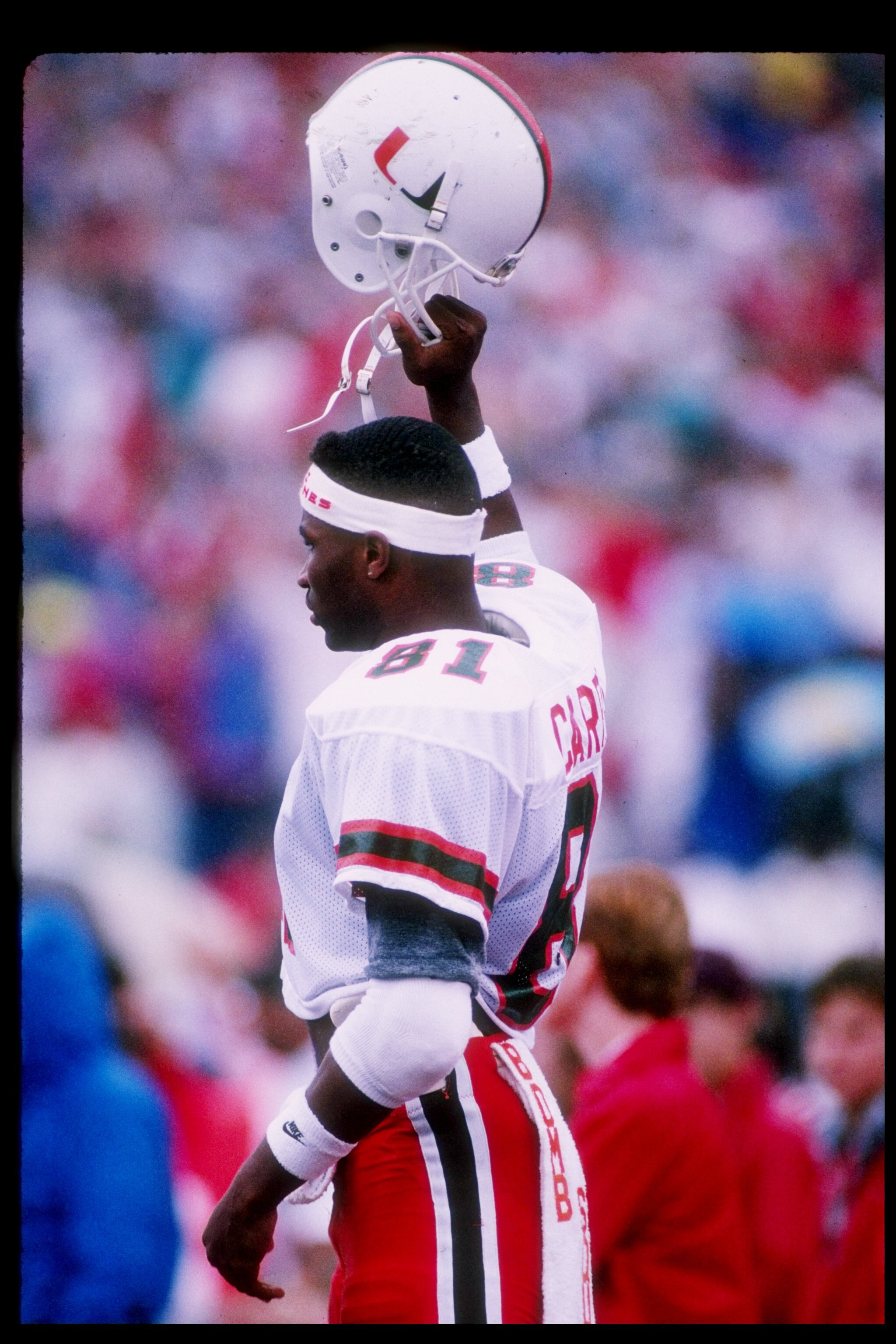 9 Sep 1989:  Wide receiver Wesley Carroll of the Miami Hurricanes holds up his helmet during a game against the Wisconsin Badgers at Camp Randall Stadium in Madison, Wisconsin.  Miami won the game 51-3. Mandatory Credit: Jonathan Daniel  /Allsport