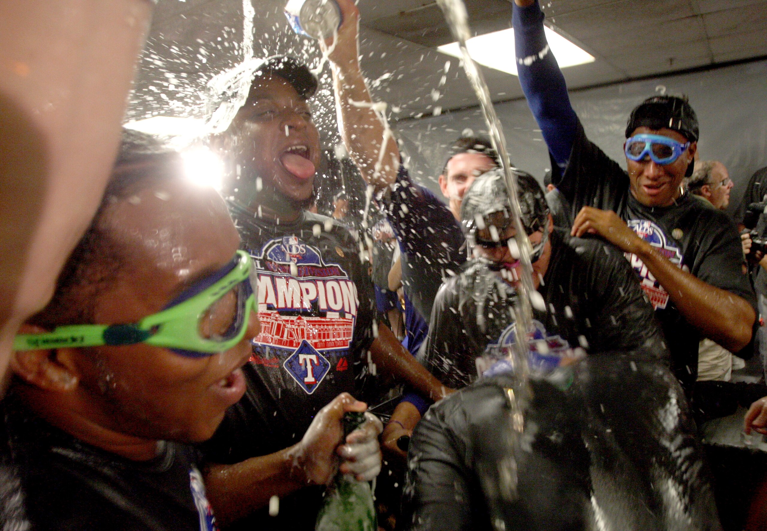OAKLAND, CA - SEPTEMBER 25:  The Texas Rangers celebrate in the lockerroom after they beat the Oakland Athletics to clinch the American League West Title at the Oakland-Alameda County Coliseum on September 25, 2010 in Oakland, California.  (Photo by Ezra