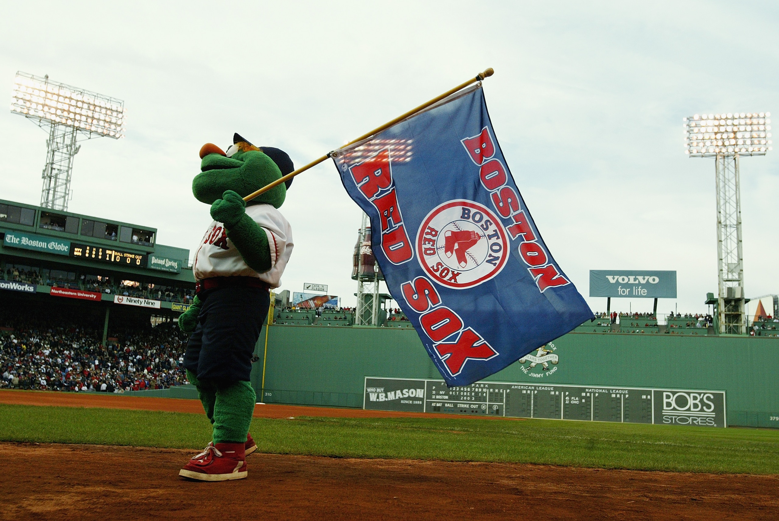 BOSTON - OCTOBER 14:  Wally the Green Monster, the Boston Red Sox mascot, entertains the fans during Game five of the 2003 American League Championship Series against the New York Yankees at Fenway Park on October 14, 2003 in Boston, Massachusetts. The Ya