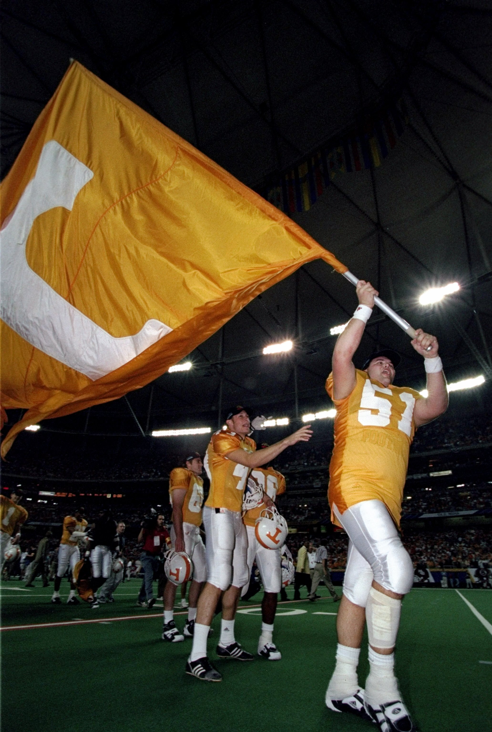 5 Dec 1998: Kevin Gregory #51 of the Tennessse Volunteers marches with a flag during the SEC Championships against the Mississippi State Bulldogs at the Georgia Dome in Athens, Georgia. Tennessee defeated Mississippi St. 24-14.