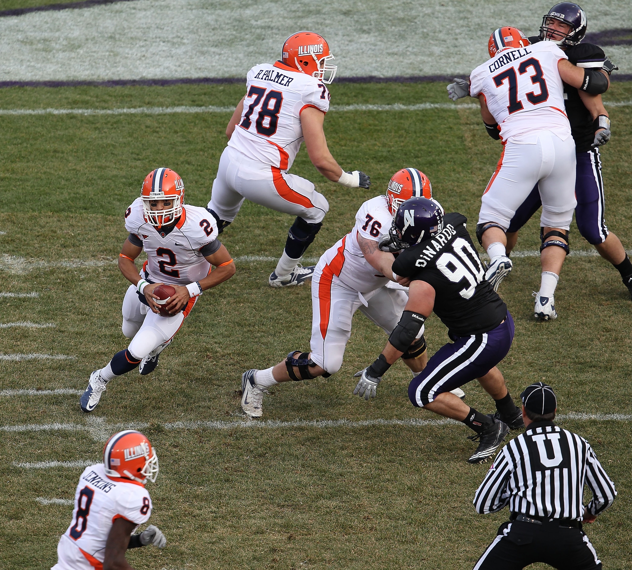 CHICAGO, IL - NOVEMBER 20: Nathan Scheelhasse #2 of the Illinois Fighting Illini runs as Jack DiNardo #90 of the Northwestern Wildcats rushes during a game played at Wrigley Field on November 20, 2010 in Chicago, Illinois. Illinois defeated Northwestern CHICAGO, IL - NOVEMBER 20: Nathan Scheelhasse #2 of the Illinois Fighting Illini runs as Jack DiNardo #90 of the Northwestern Wildcats rushes during a game played at Wrigley Field on November 20, 2010 in Chicago, Illinois. Illinois defeated Northwestern
