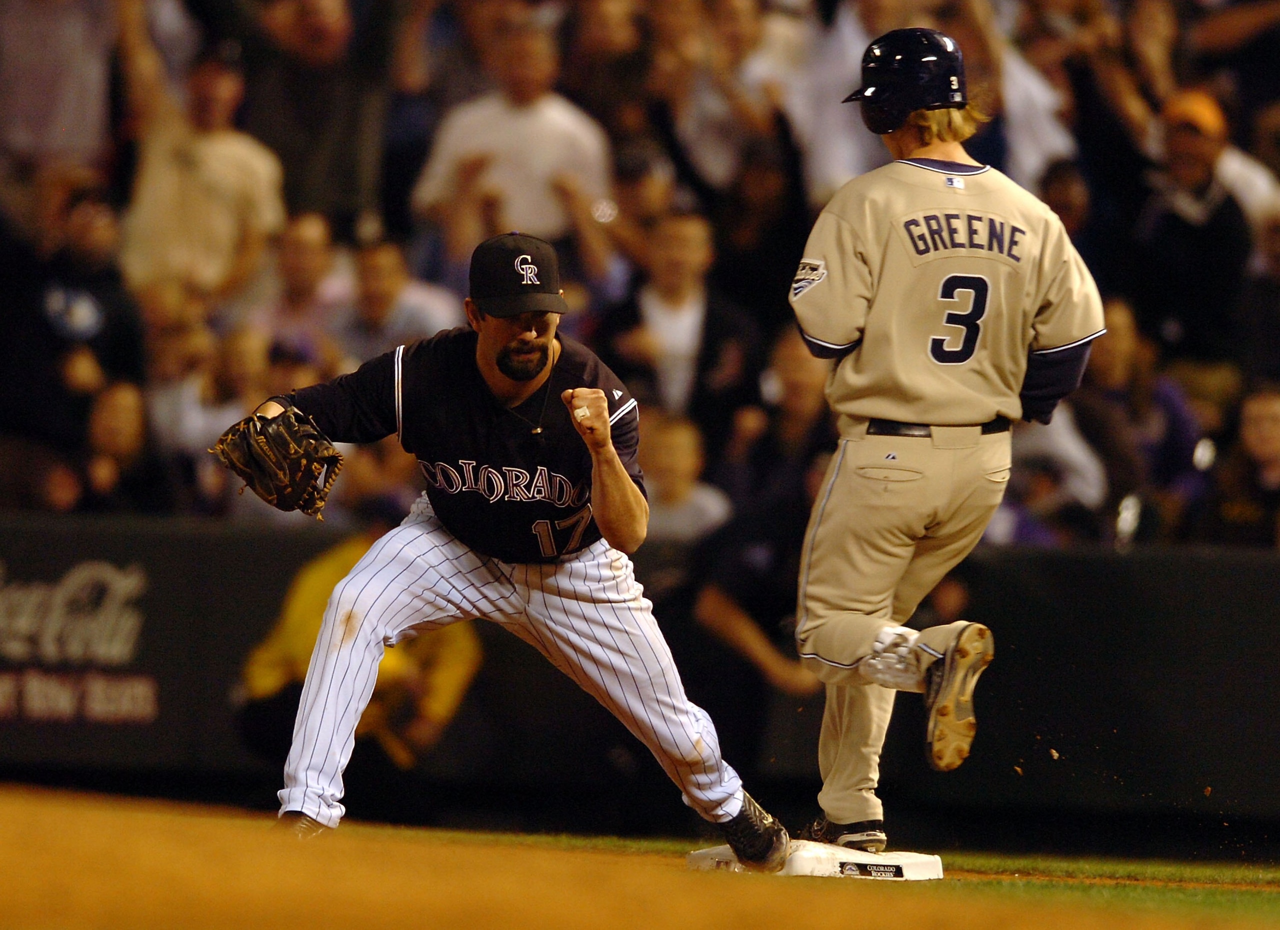 DENVER - OCTOBER 01: Todd Helton #17 of the Colorado Rockies pumps his fist as he completes the play to put out Khalil Green #3 of the San Diego Padres in the wildcard baseball playoff game on October 1, 2007 in Denver, Colorado. (Photo by Steve Dykes/Get
