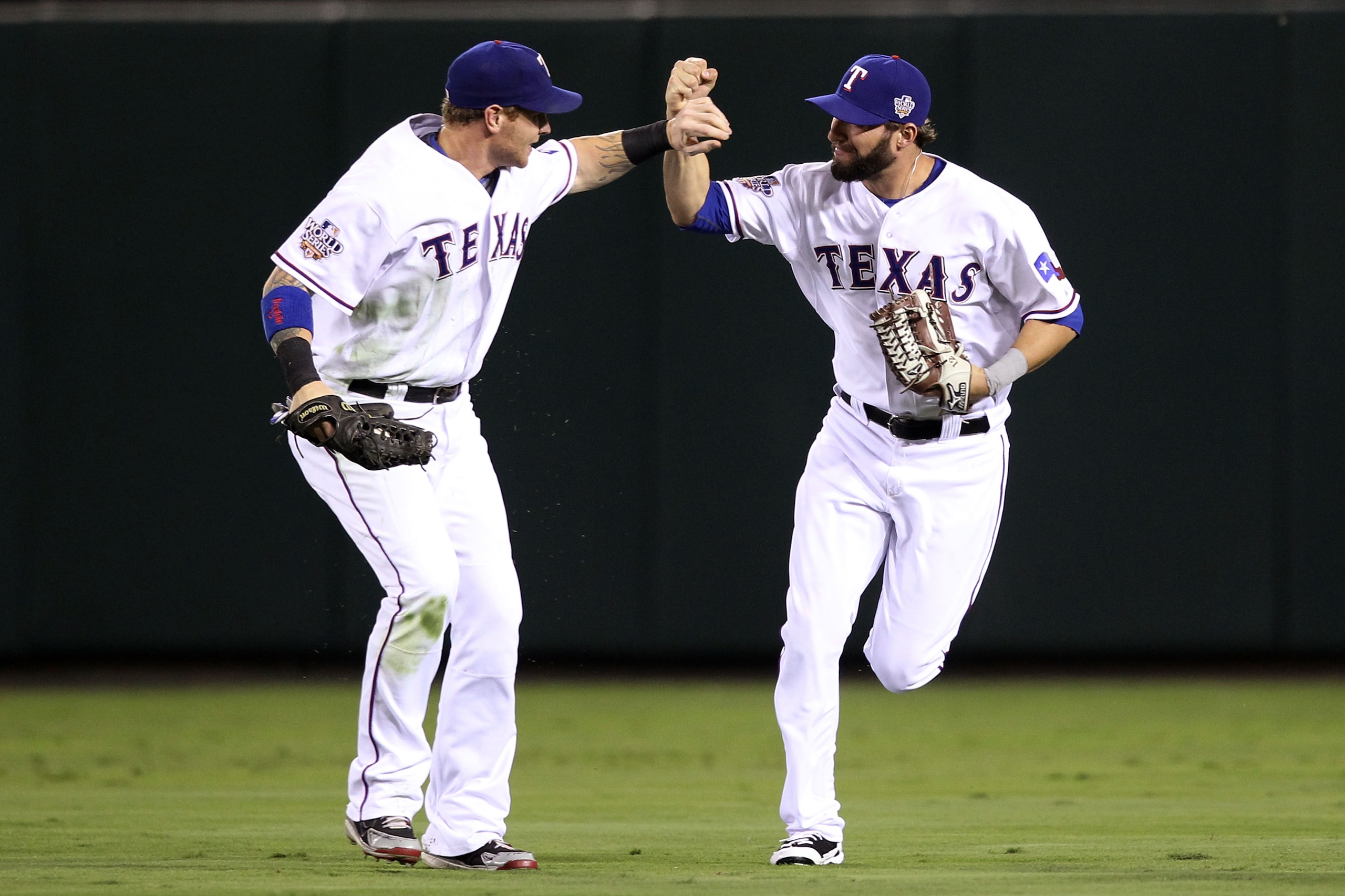 ARLINGTON, TX - OCTOBER 31:  Josh Hamilton #32 of the Texas Rangers is congratulated by Jeff Francoeur #21 after making a diving catch in the second inning against the San Francisco Giants in Game Four of the 2010 MLB World Series at Rangers Ballpark in A