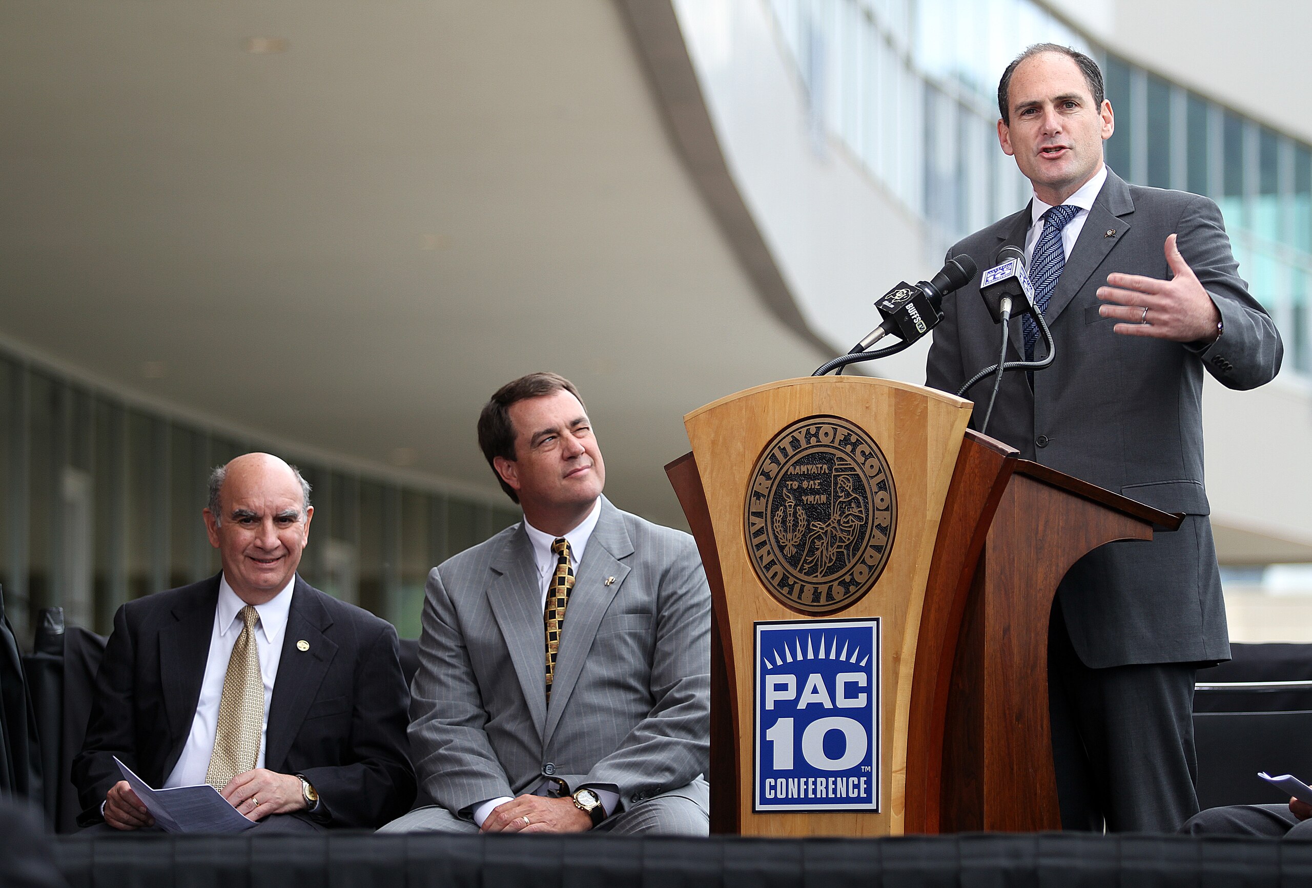 BOULDER, CO - JUNE 11: (R-L) PAC-10 Commissioner Larry Scott speaks as Colorado Athletic Director Mike Bohn and University of Colorado Chancellor Phil DiStefano listen during a press conference at Folsom Stadium on June 11, 2010 in Boulder, Colorado. The