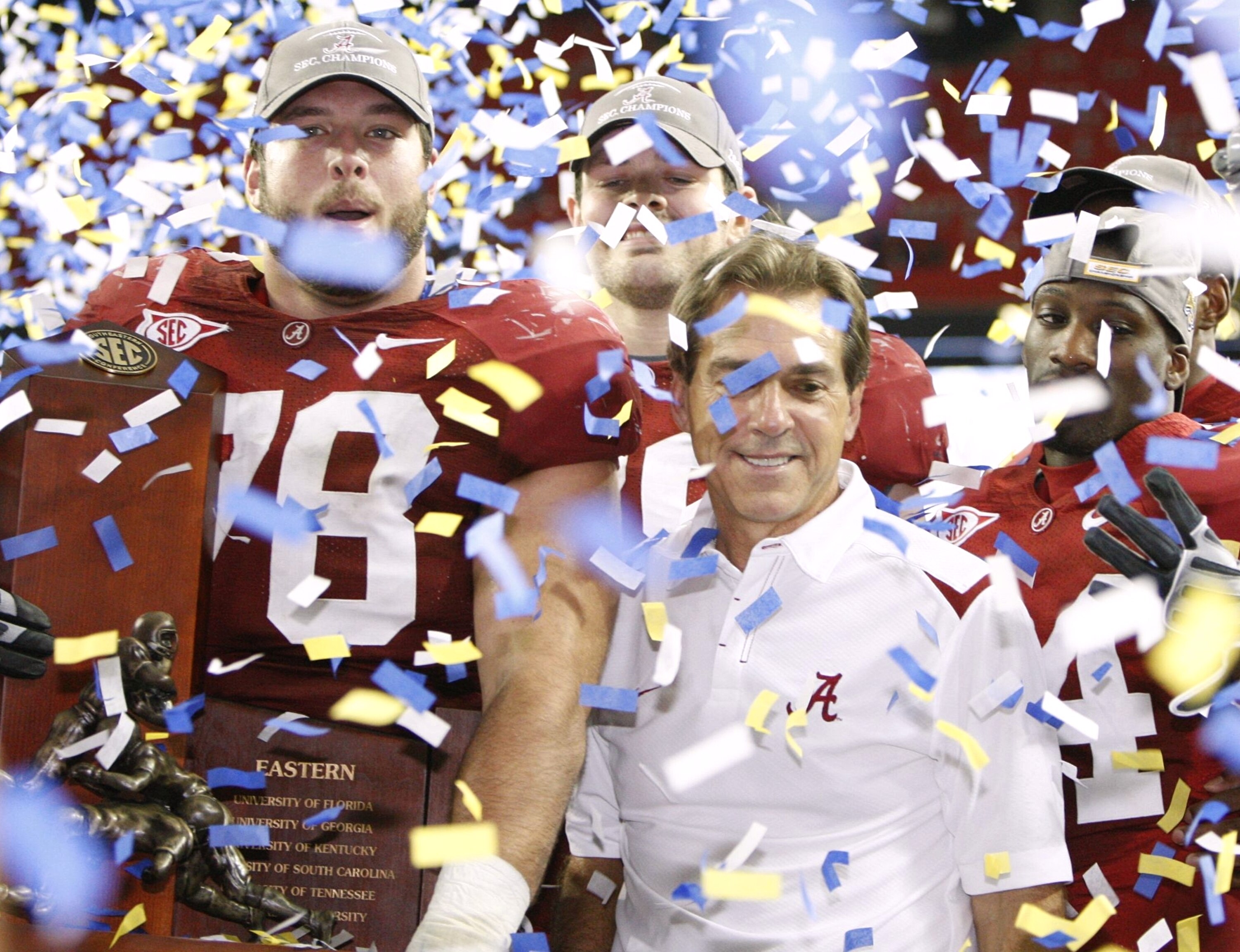 ATLANTA - DECEMBER 5:  Head coach Nick Saban and Mike Johnson #78 of the Alabama Crimson Tide celebrate after their 32-13 win against the Florida Gators during the SEC Championship game at Georgia Dome on December 5, 2009 in Atlanta, Georgia.  (Photo by K