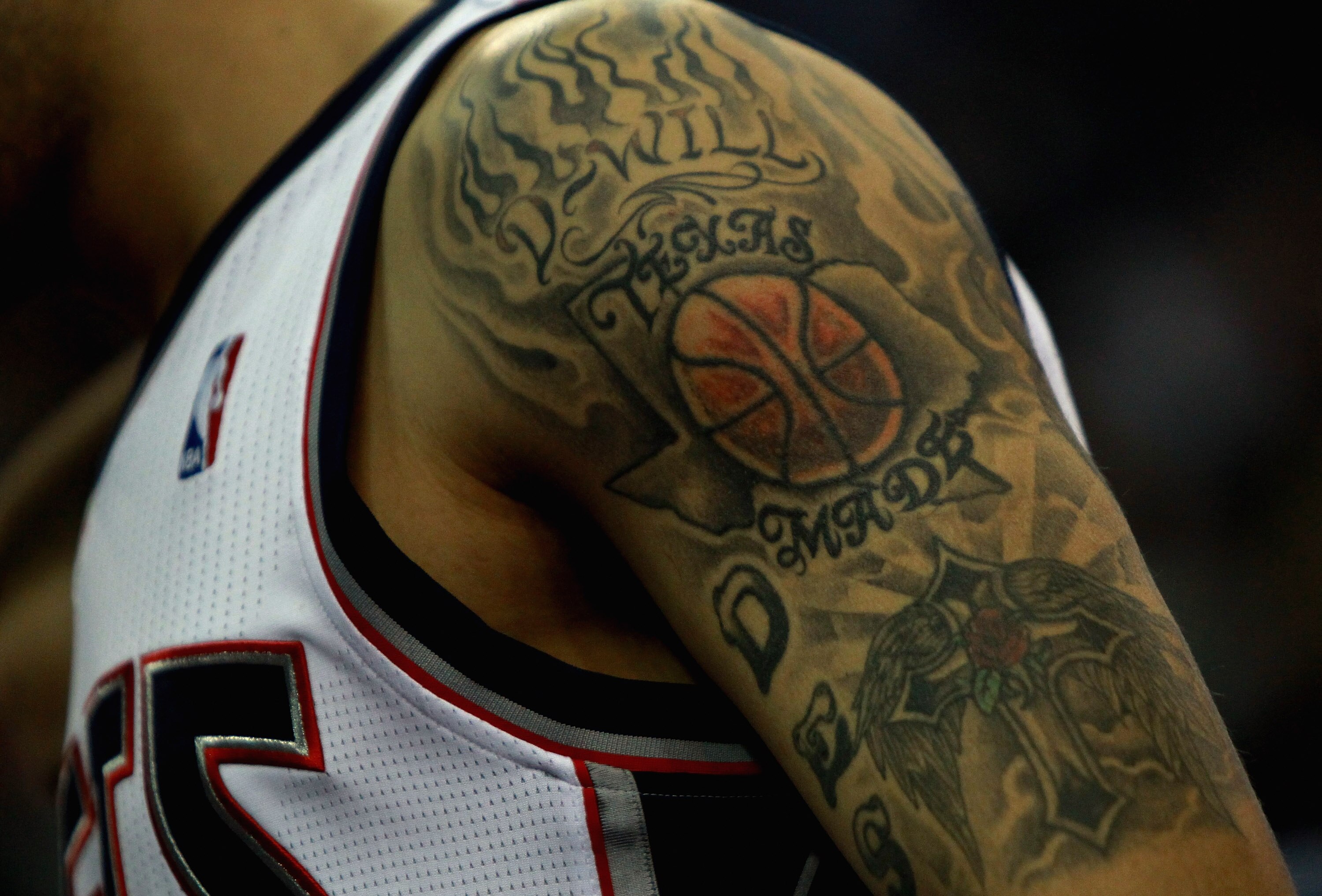 LONDON, ENGLAND - MARCH 04:  A tatoo on the arm of #8 Deron Williams of the Nets is pictured during the NBA match between New Jersey Nets and the Toronto Raptors at the O2 Arena on March 4, 2011 in London, England. NOTE TO USER: User expressly acknowledge