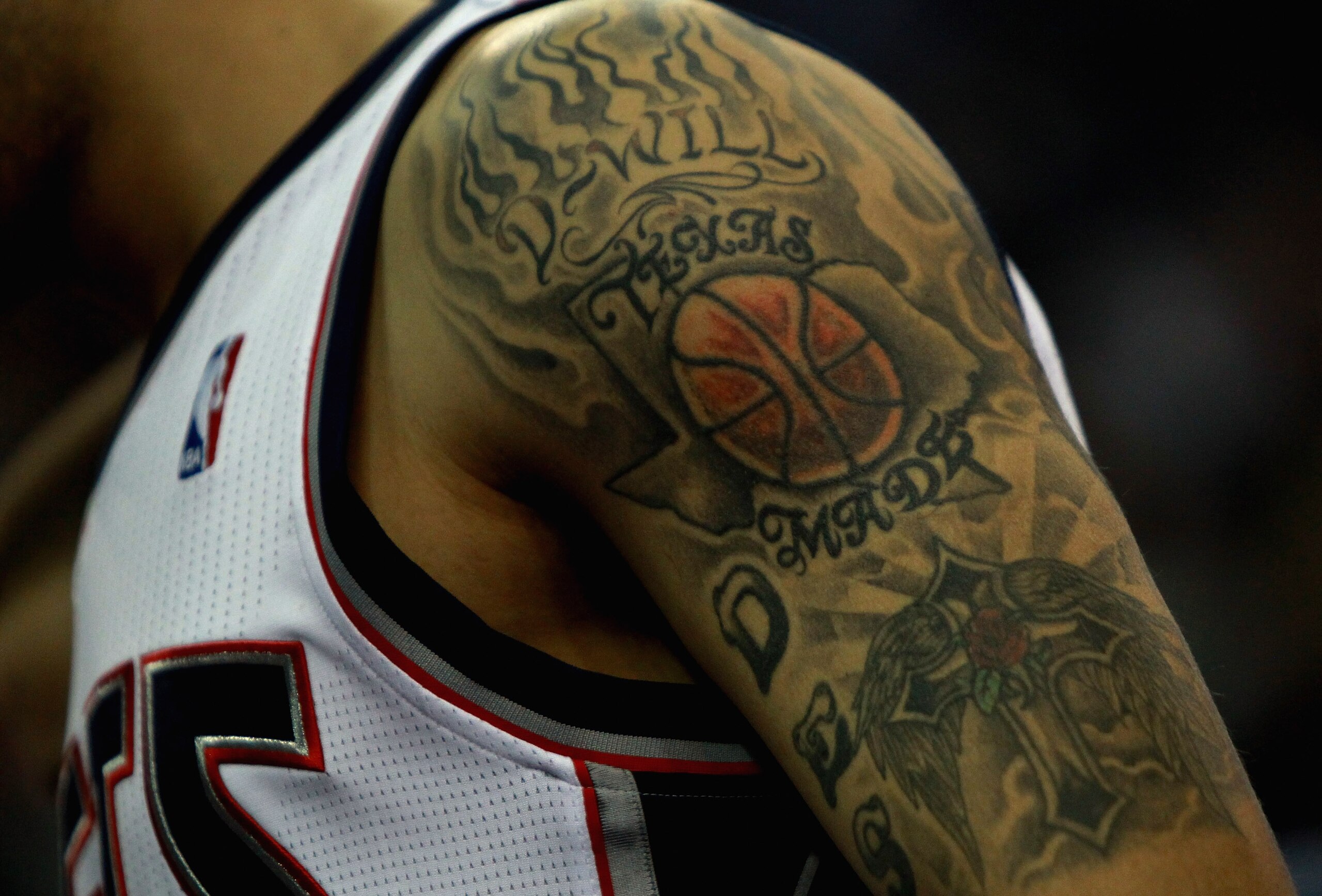 LONDON, ENGLAND - MARCH 04: A tatoo on the arm of #8 Deron Williams of the Nets is pictured during the NBA match between New Jersey Nets and the Toronto Raptors at the O2 Arena on March 4, 2011 in London, England. NOTE TO USER: User expressly acknowledge LONDON, ENGLAND - MARCH 04: A tatoo on the arm of #8 Deron Williams of the Nets is pictured during the NBA match between New Jersey Nets and the Toronto Raptors at the O2 Arena on March 4, 2011 in London, England. NOTE TO USER: User expressly acknowledge