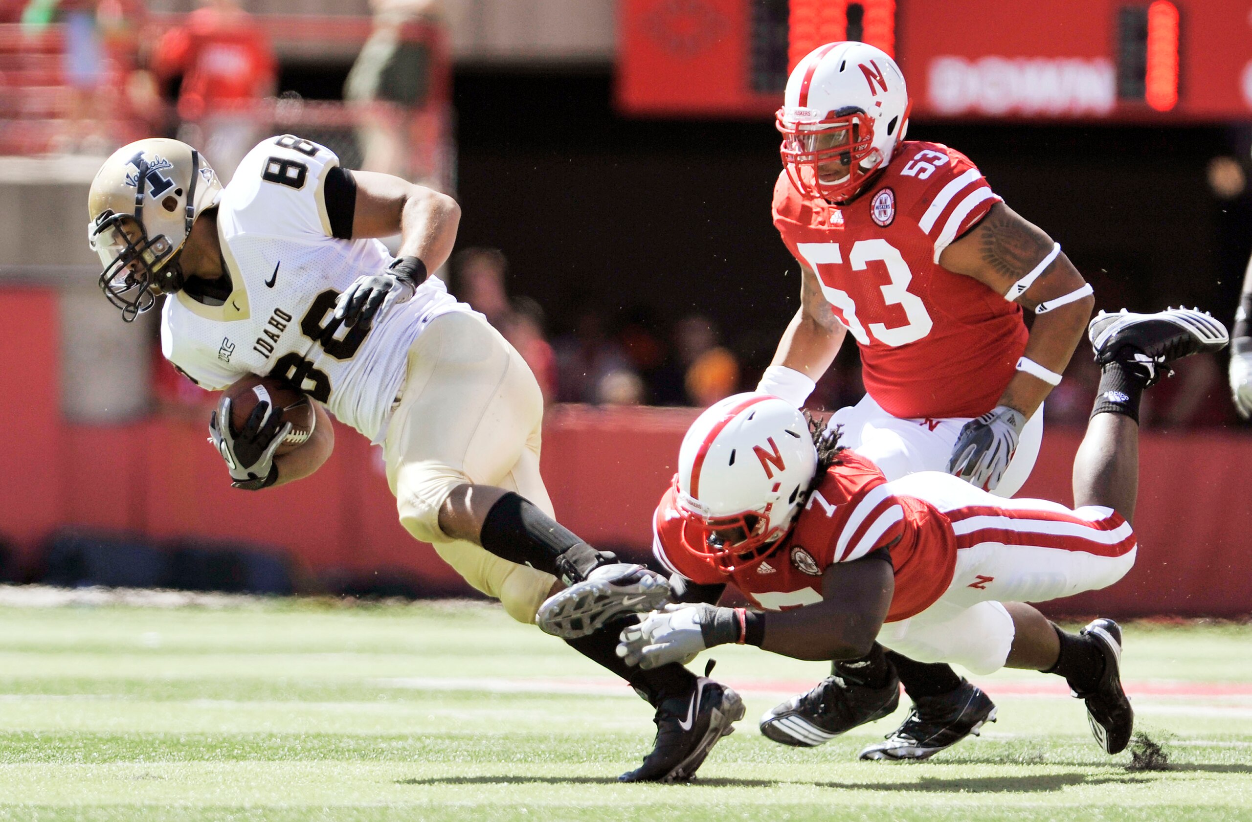 LINCOLN, NEBRASKA - SEPTEMBER 11: Nebraska Cornhuskers defensive back DeJon Gomes #7 trips up Idaho Vandals wide receiver Daniel Hardy #88 during second half action of their game at Memorial Stadium on September 4, 2010 in Lincoln, Nebraska. Nebraska defe