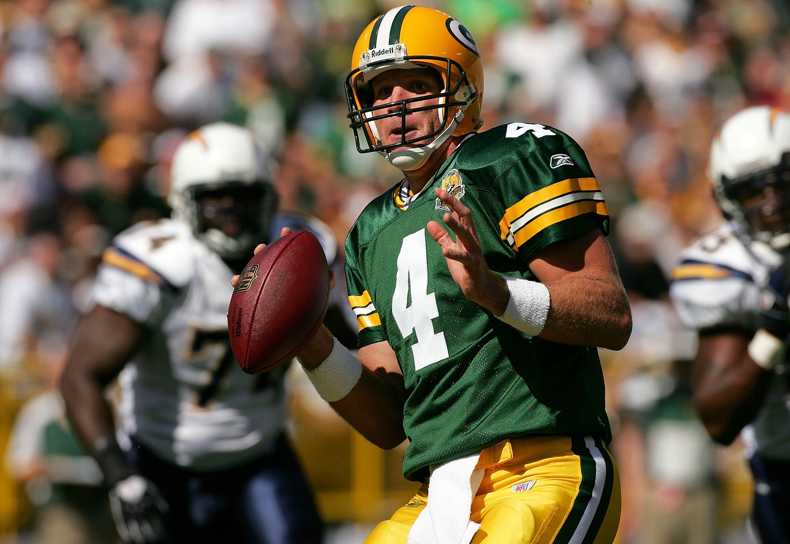 GREEN BAY, WI - SEPTEMBER 23:  Quarterback Brett Favre #4 of the Green Bay Packers is chased out of the pocket against the San Diego Chargers at Lambeau Field September 23, 2007 in Green Bay, Wisconsin.  (Photo by Matthew Stockman/Getty Images)