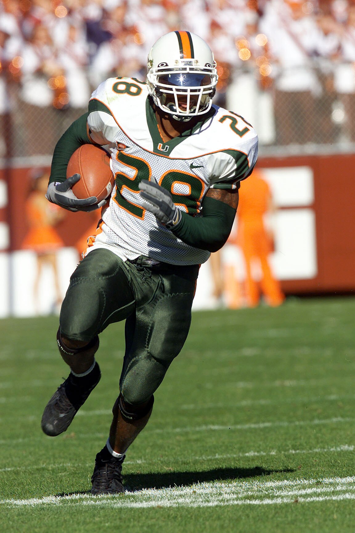 1 Dec 2001:  Clinton Portis #28 of Miami runs with the ball during the first half of the Miami Hurricanes v Virginia Tech Hokies game at Lane Stadium in Blacksburg, Virgina. DIGITAL IMAGE. Mandatory Credit: Craig Jones/ALLSPORT