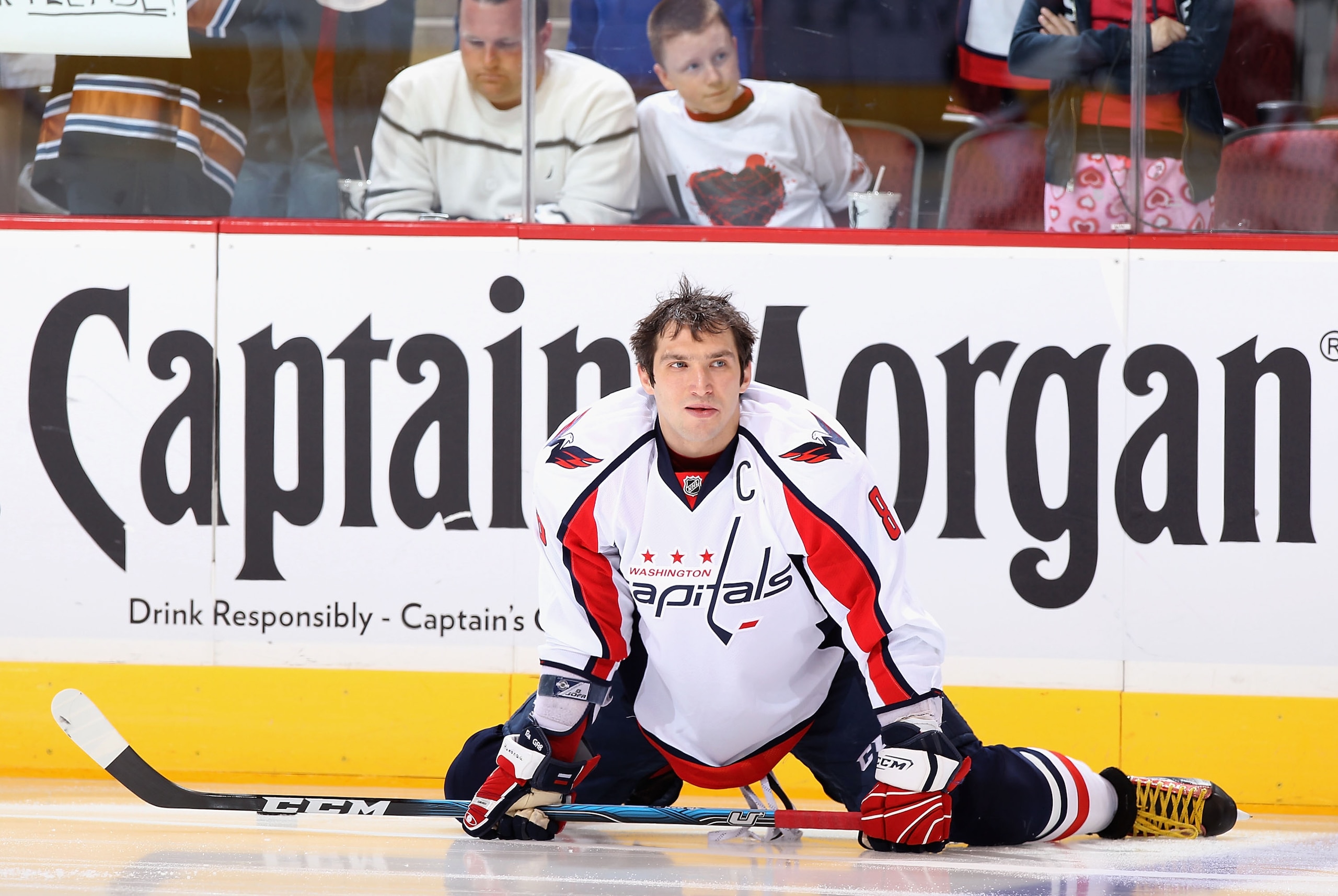 GLENDALE, AZ - FEBRUARY 14:  Alex Ovechkin #8 of the Washington Capitals stretches on the ice during warm ups to the NHL game against the Phoenix Coyotes at Jobing.com Arena on February 14, 2011 in Glendale, Arizona.  (Photo by Christian Petersen/Getty Im