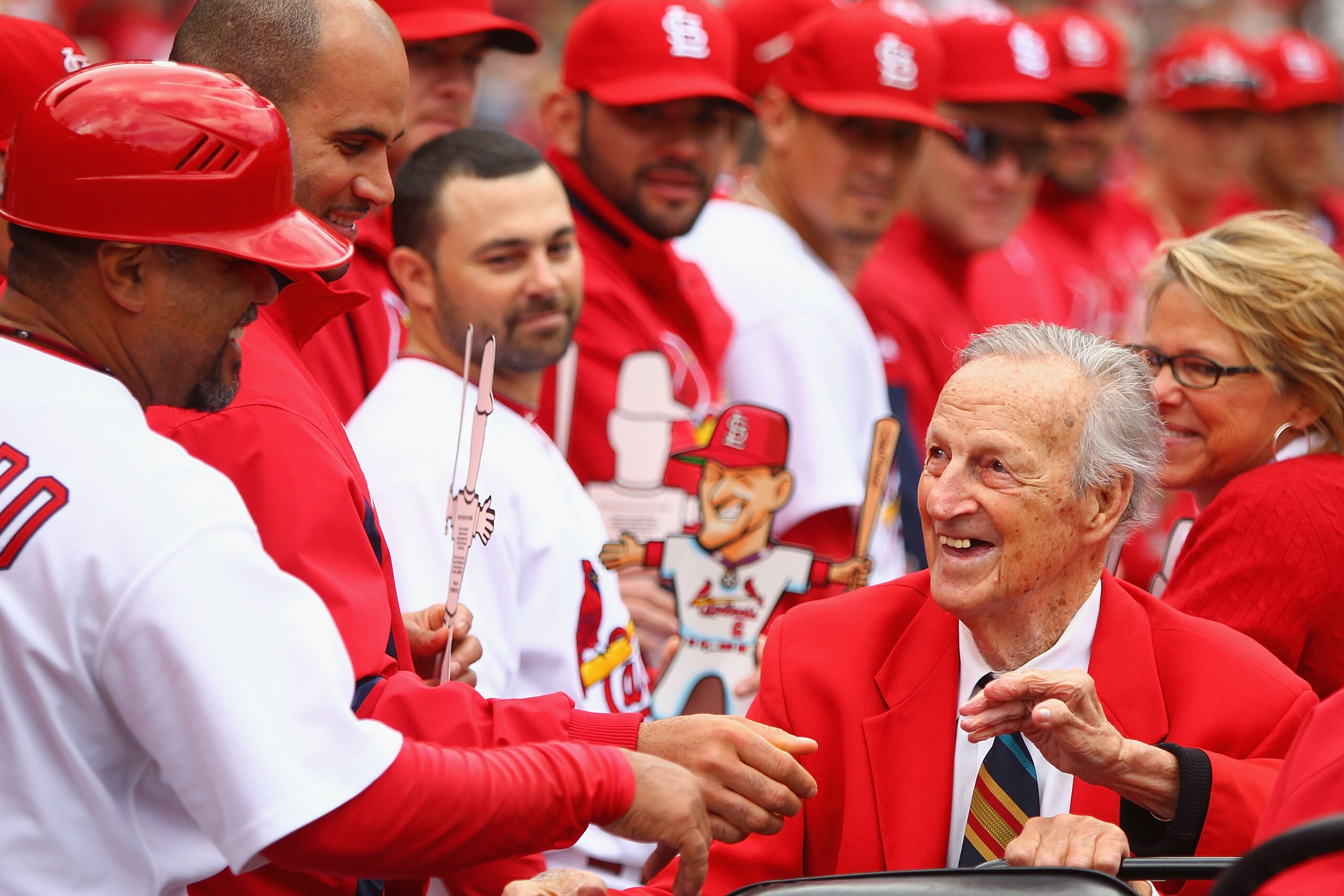 ST. LOUIS - OCTOBER 2: Former St. Louis Cardinals player Stan Musial greets members of the St. Louis Cardinals in between innings against the Colorado Rockies at Busch Stadium on October 2, 2010 in St. Louis, Missouri. The Cardinals beat the Rockies 1-0 ST. LOUIS - OCTOBER 2: Former St. Louis Cardinals player Stan Musial greets members of the St. Louis Cardinals in between innings against the Colorado Rockies at Busch Stadium on October 2, 2010 in St. Louis, Missouri. The Cardinals beat the Rockies 1-0