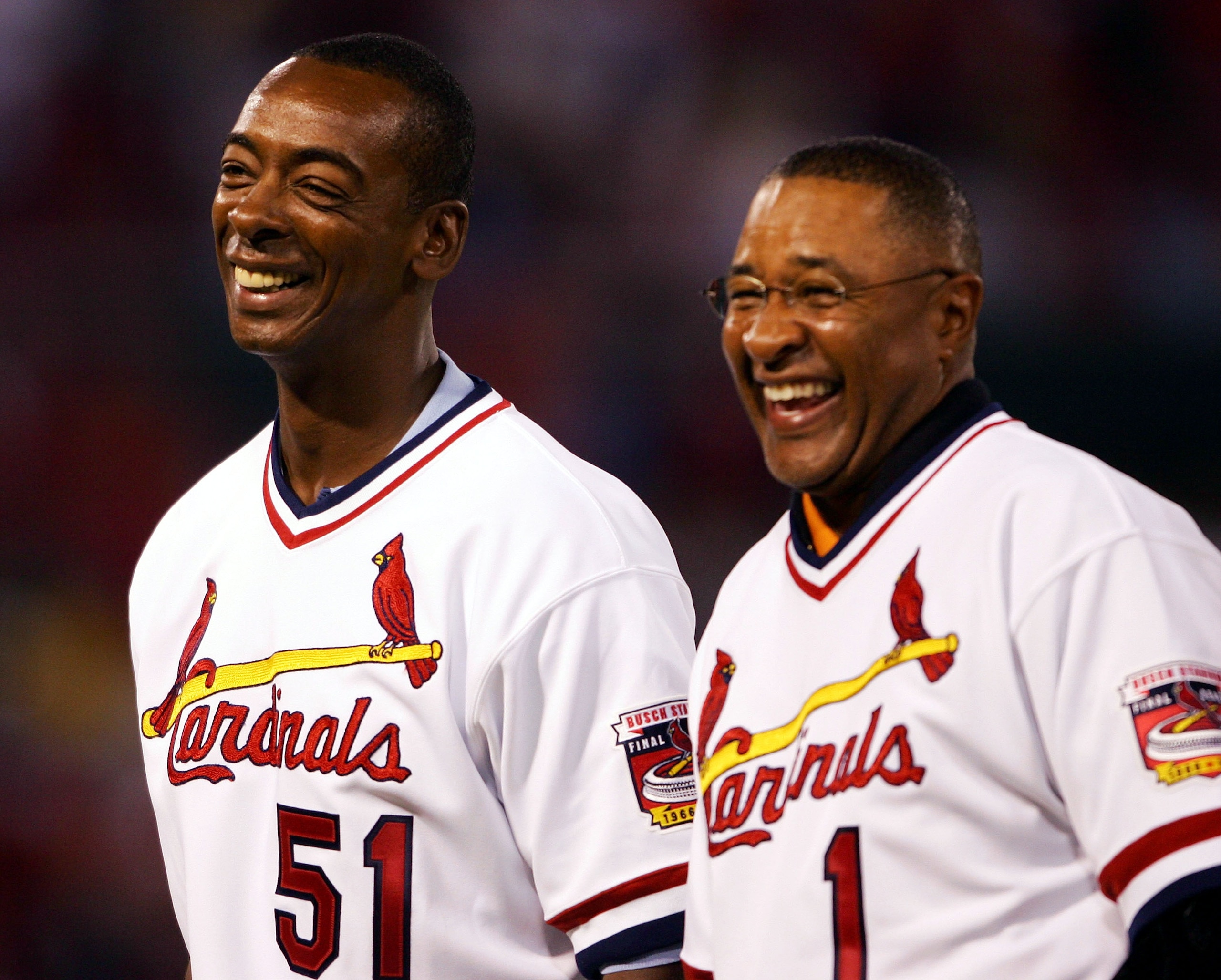 ST. LOUIS - SEPTEMBER 30: Ozzie Smith #1 and Willie McGee #51 of the 1985 St. Louis Cardinals team stand on the field before the game on September 30, 2005 at Busch Stadium in St. Louis, Missouri. (Photo by Elsa/Getty Images). ST. LOUIS - SEPTEMBER 30: Ozzie Smith #1 and Willie McGee #51 of the 1985 St. Louis Cardinals team stand on the field before the game on September 30, 2005 at Busch Stadium in St. Louis, Missouri. (Photo by Elsa/Getty Images).