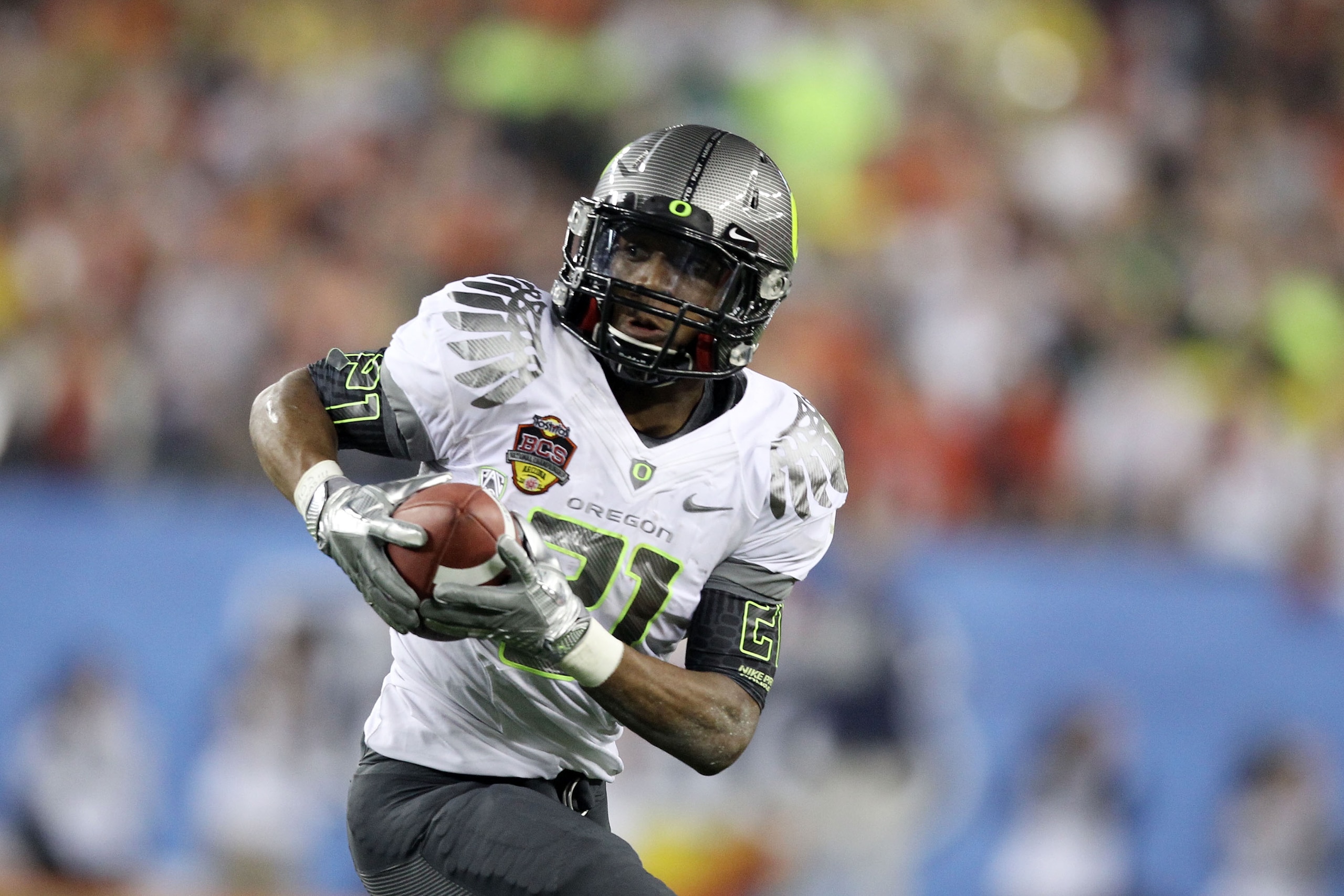 GLENDALE, AZ - JANUARY 10: LaMichael James #21 of the Oregon Ducks runs down field against the Auburn Tigers during the Tostitos BCS National Championship Game at University of Phoenix Stadium on January 10, 2011 in Glendale, Arizona. (Photo by Christia GLENDALE, AZ - JANUARY 10: LaMichael James #21 of the Oregon Ducks runs down field against the Auburn Tigers during the Tostitos BCS National Championship Game at University of Phoenix Stadium on January 10, 2011 in Glendale, Arizona. (Photo by Christia