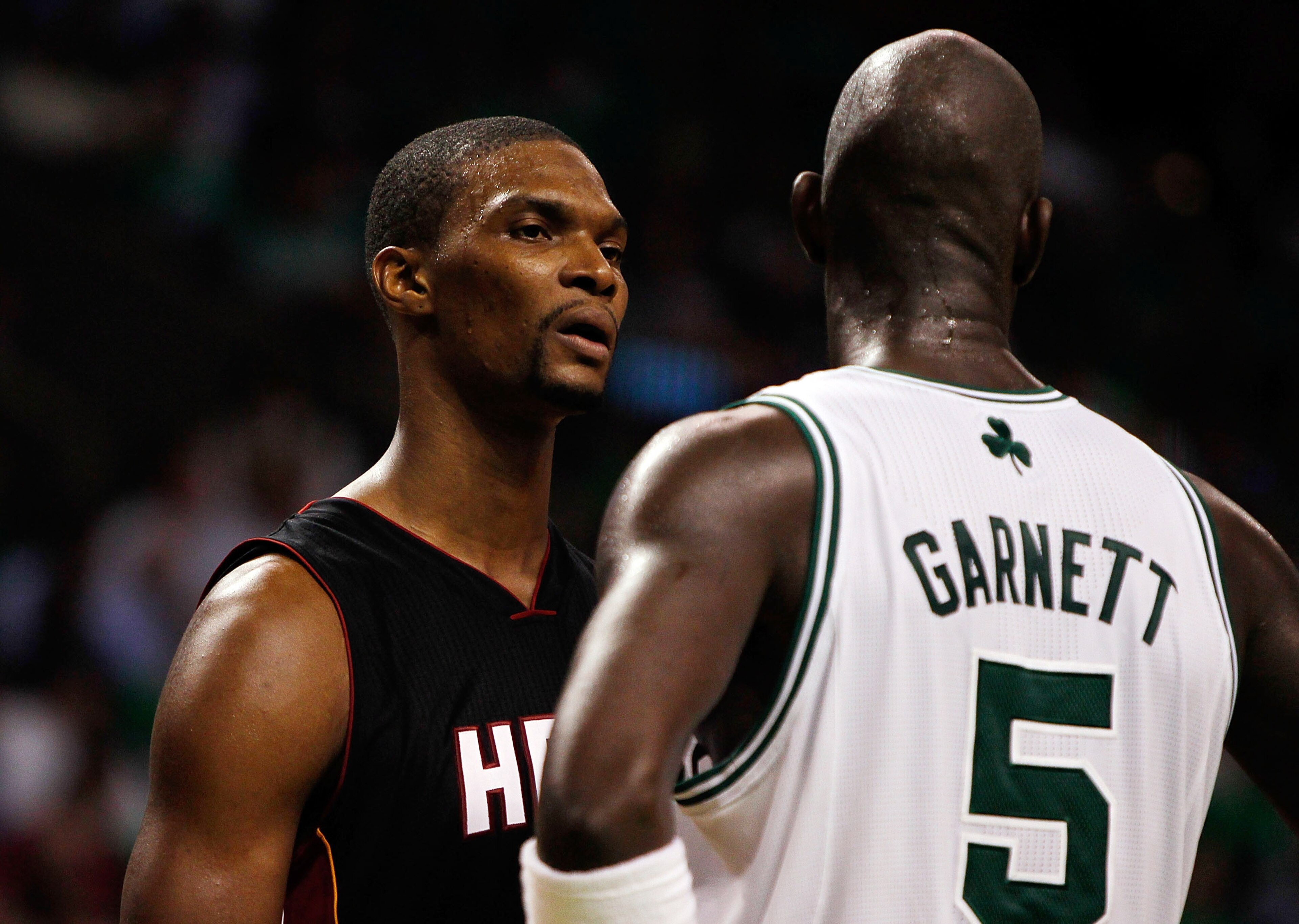 BOSTON, MA - OCTOBER 26: Chris Bosh #1 of the Miami Heat has words with Kevin Garnett #5 of the Boston Celtics at the TD Banknorth Garden on October 26, 2010 in Boston, Massachusetts.  The Heat lost 88-80. NOTE TO USER: User expressly acknowledges and agr