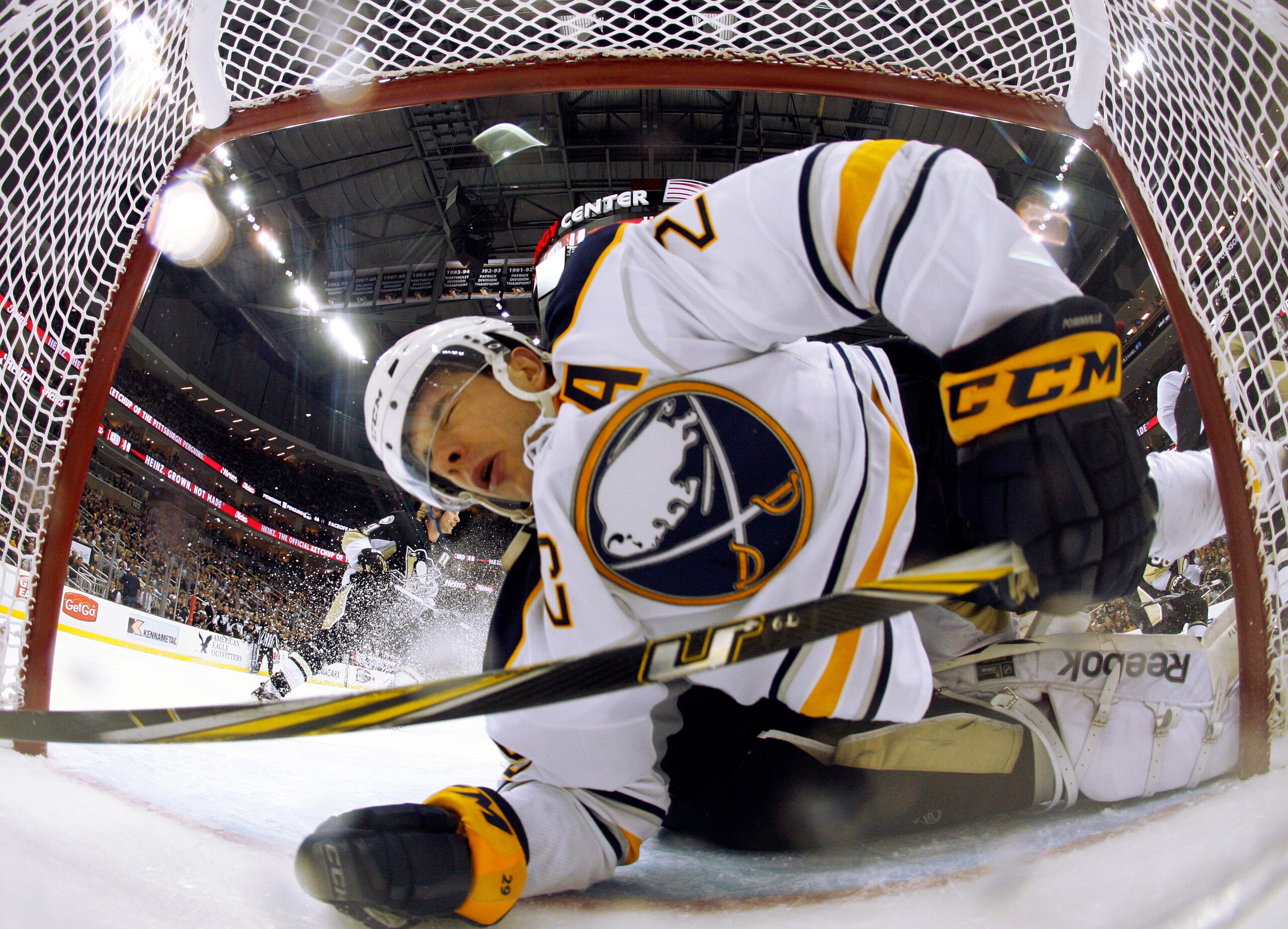 PITTSBURGH, PA - FEBRUARY 04:  Jason Pominville #29 of the Buffalo Sabres crashes the net against Marc-Andre Fleury #29 of the Pittsburgh Penguins at Consol Energy Center on February 4, 2011 in Pittsburgh, Pennsylvania.  The Penguins defeated Buffalo 3-2.