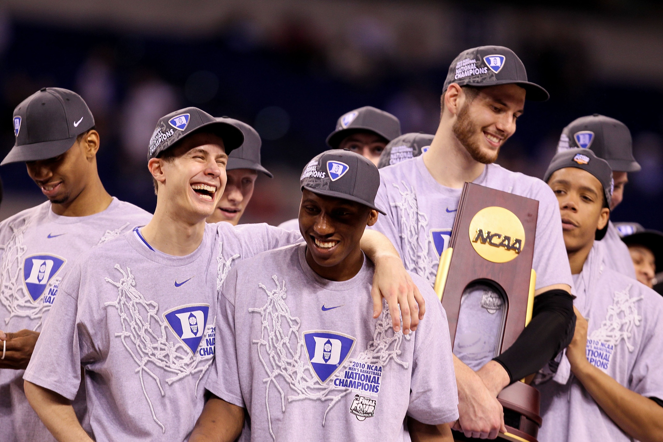 INDIANAPOLIS - APRIL 05: (L-R) Jon Scheyer #30, Nolan Smith #2 and Brian Zoubek #55 of the Duke Blue Devils celebrate with the trophy after they won 61-59 against the Butler Bulldogs during the 2010 NCAA Division I Men's Basketball National Championship INDIANAPOLIS - APRIL 05: (L-R) Jon Scheyer #30, Nolan Smith #2 and Brian Zoubek #55 of the Duke Blue Devils celebrate with the trophy after they won 61-59 against the Butler Bulldogs during the 2010 NCAA Division I Men's Basketball National Championship