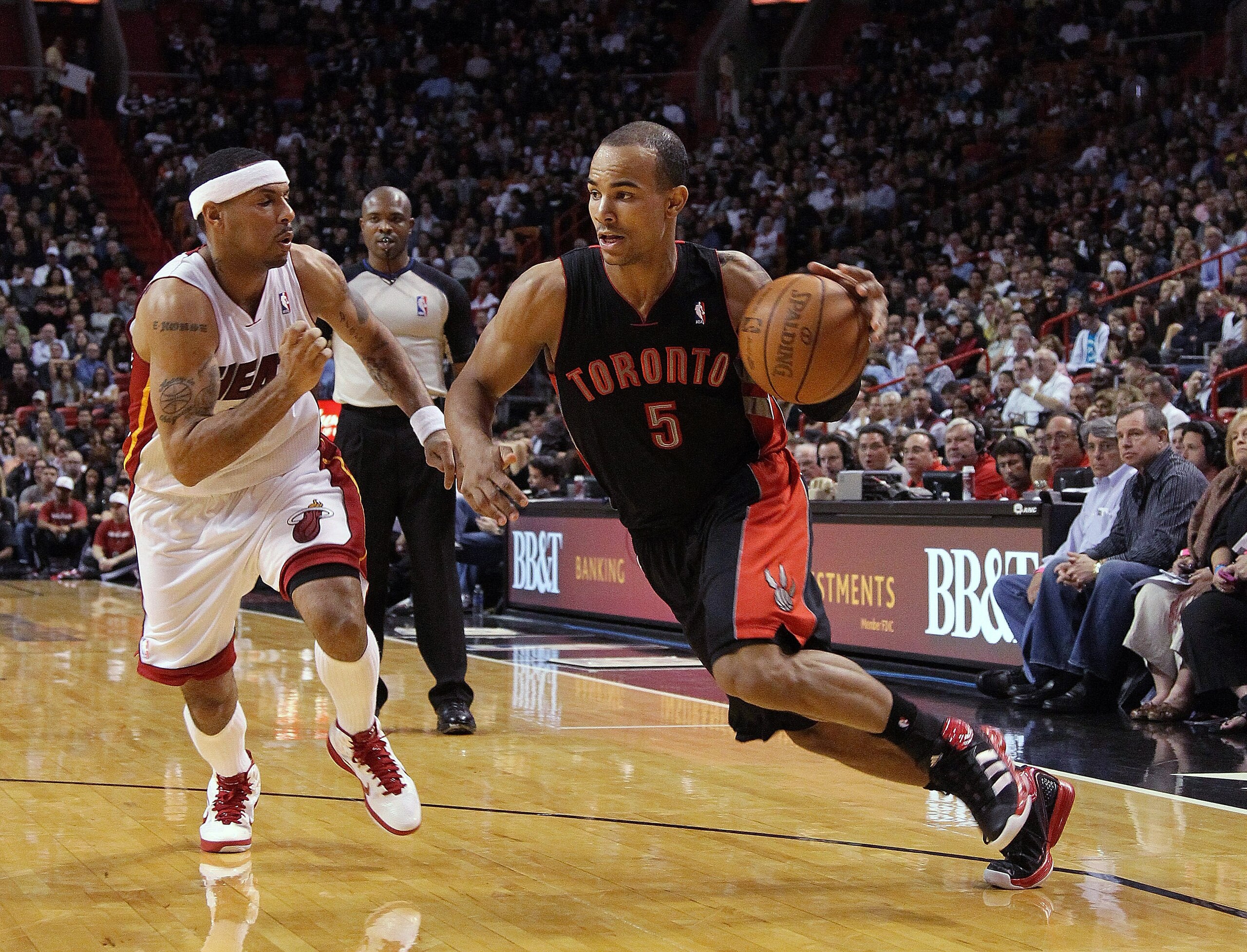 MIAMI, FL - JANUARY 22: Jerryd Bayless #5 of the Toronto Raptors dribbles past Eddie House #55 of the Miami Heat during a game at American Airlines Arena on January 22, 2011 in Miami, Florida. NOTE TO USER: User expressly acknowledges and agrees that, by MIAMI, FL - JANUARY 22: Jerryd Bayless #5 of the Toronto Raptors dribbles past Eddie House #55 of the Miami Heat during a game at American Airlines Arena on January 22, 2011 in Miami, Florida. NOTE TO USER: User expressly acknowledges and agrees that, by