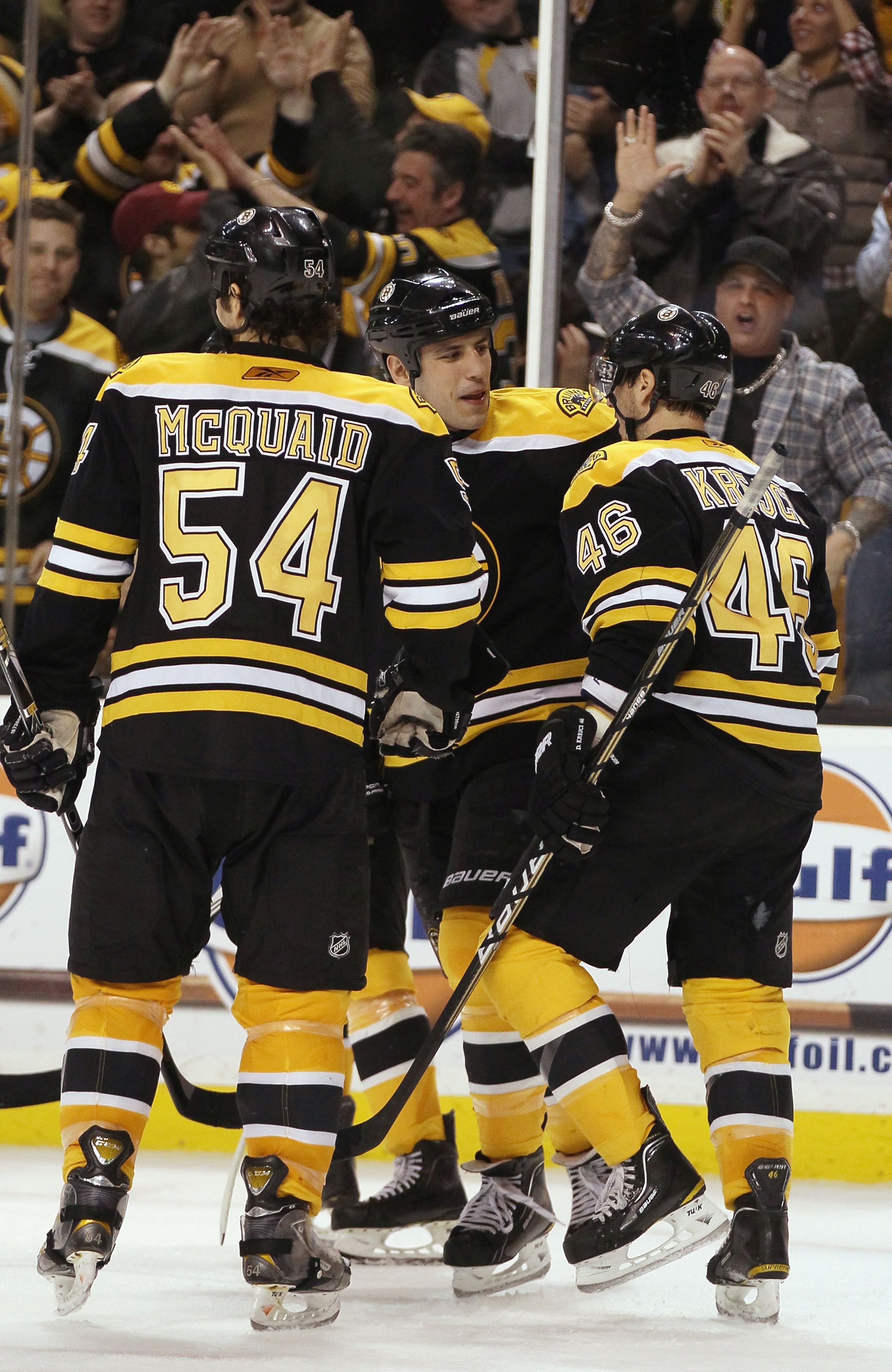BOSTON, MA - FEBRUARY 09:  Milan Lucic #17,David Krejci #46 and Adam McQuaid #54 of the Boston Bruins celebrate a goal in the third period against the Montreal Canadiens on February 9, 2011 at the TD Garden in Boston, Massachusetts. The Bruins defeated th