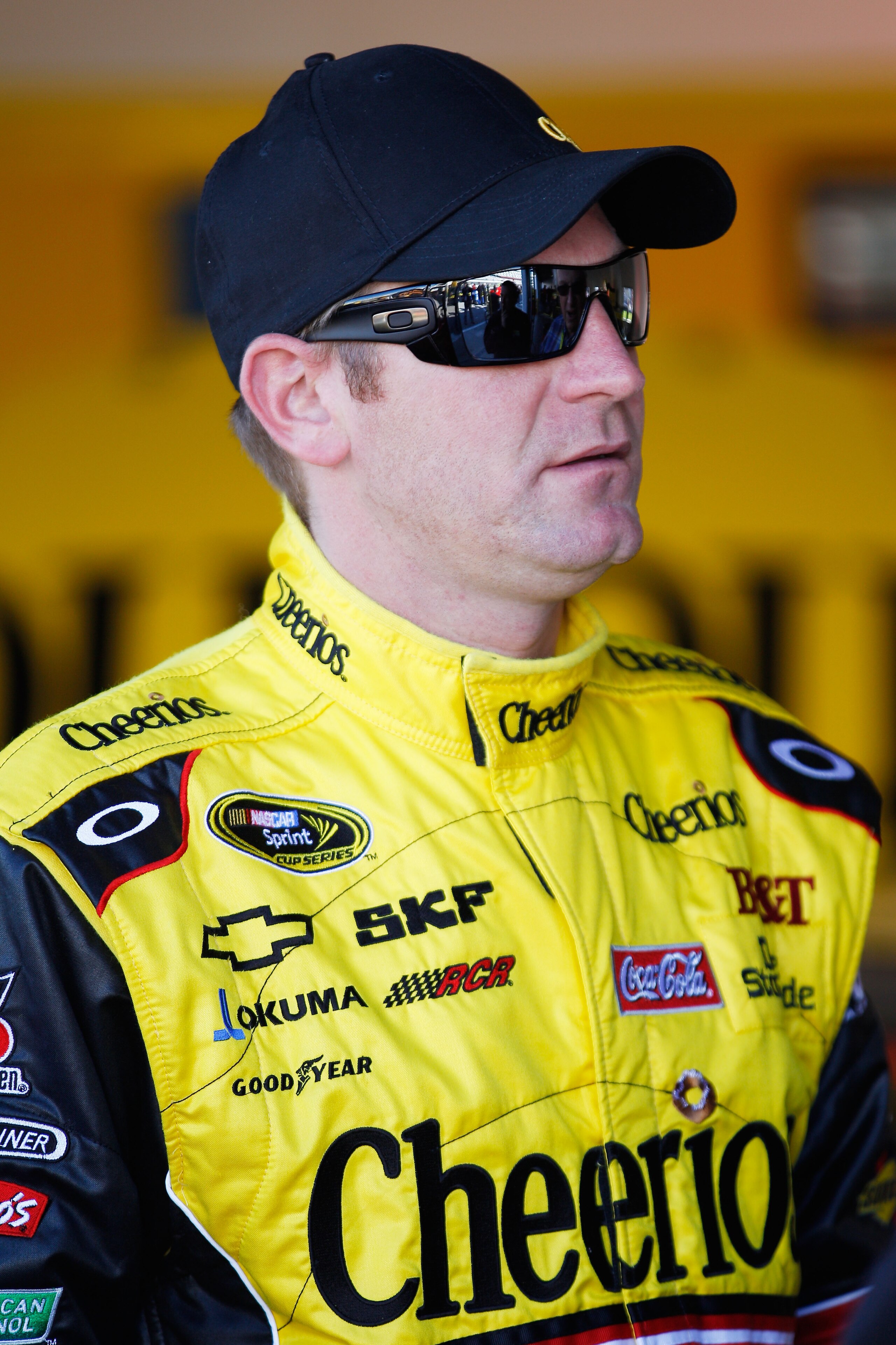 DAYTONA BEACH, FL - FEBRUARY 12:  Clint Bowyer, driver of the #33 Cheerios Chevrolet, stands in the garage area during practice for the NASCAR Sprint Cup Series Daytona 500 at Daytona International Speedway on February 12, 2011 in Daytona Beach, Florida.