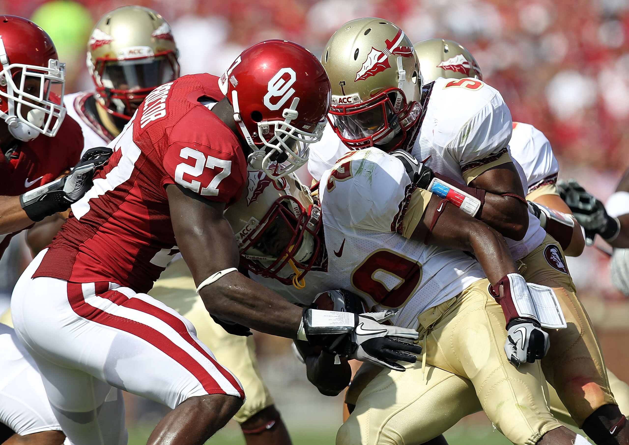 NORMAN, OK - SEPTEMBER 11:  Lamarcus Joyner #20 of the Florida State Seminoles returns a kick against Sam Proctor #27 of the Oklahoma Sooners at Gaylord Family Oklahoma Memorial Stadium on September 11, 2010 in Norman, Oklahoma.  (Photo by Ronald Martinez