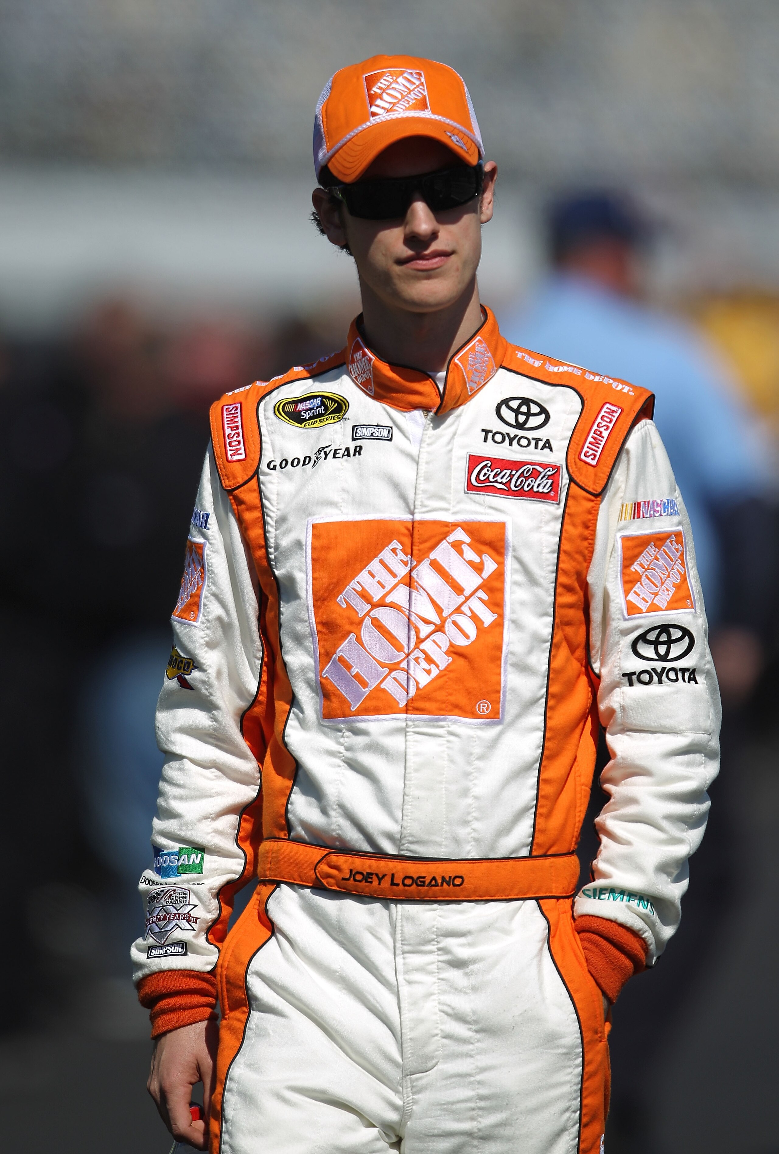 DAYTONA BEACH, FL - FEBRUARY 13:  Joey Logano, driver of the #20 Home Depot Toyota, walks during qualifying for the NASCAR Sprint Cup Series Daytona 500 at Daytona International Speedway on February 13, 2011 in Daytona Beach, Florida.  (Photo by Nick Laha