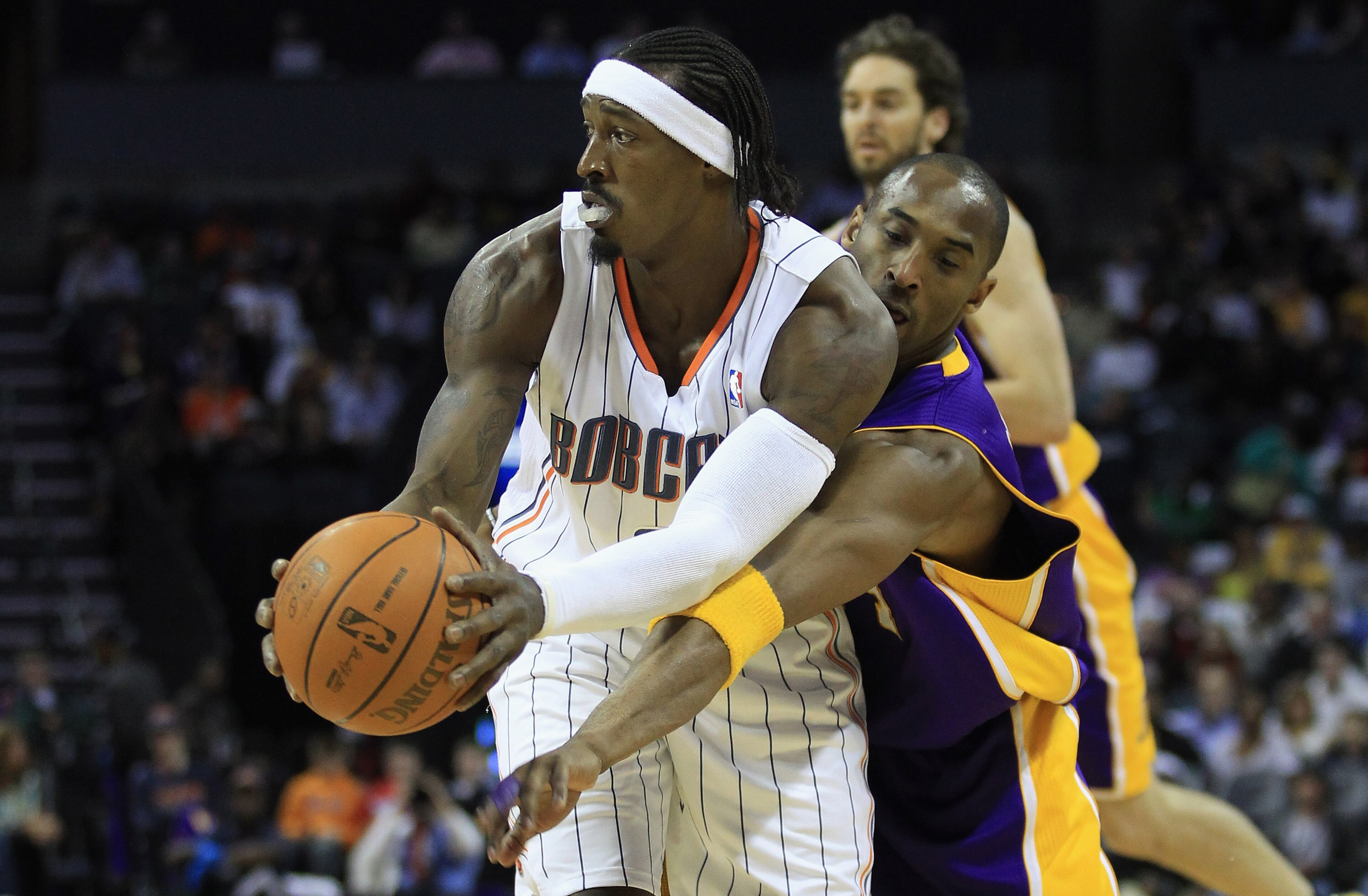 CHARLOTTE, NC - FEBRUARY 14:  Kobe Bryant #24 of the Los Angeles Lakers tries to steal the ball away from Gerald Wallace #3 of the Charlotte Bobcats during their game at Time Warner Cable Arena on February 14, 2011 in Charlotte, North Carolina. NOTE TO US