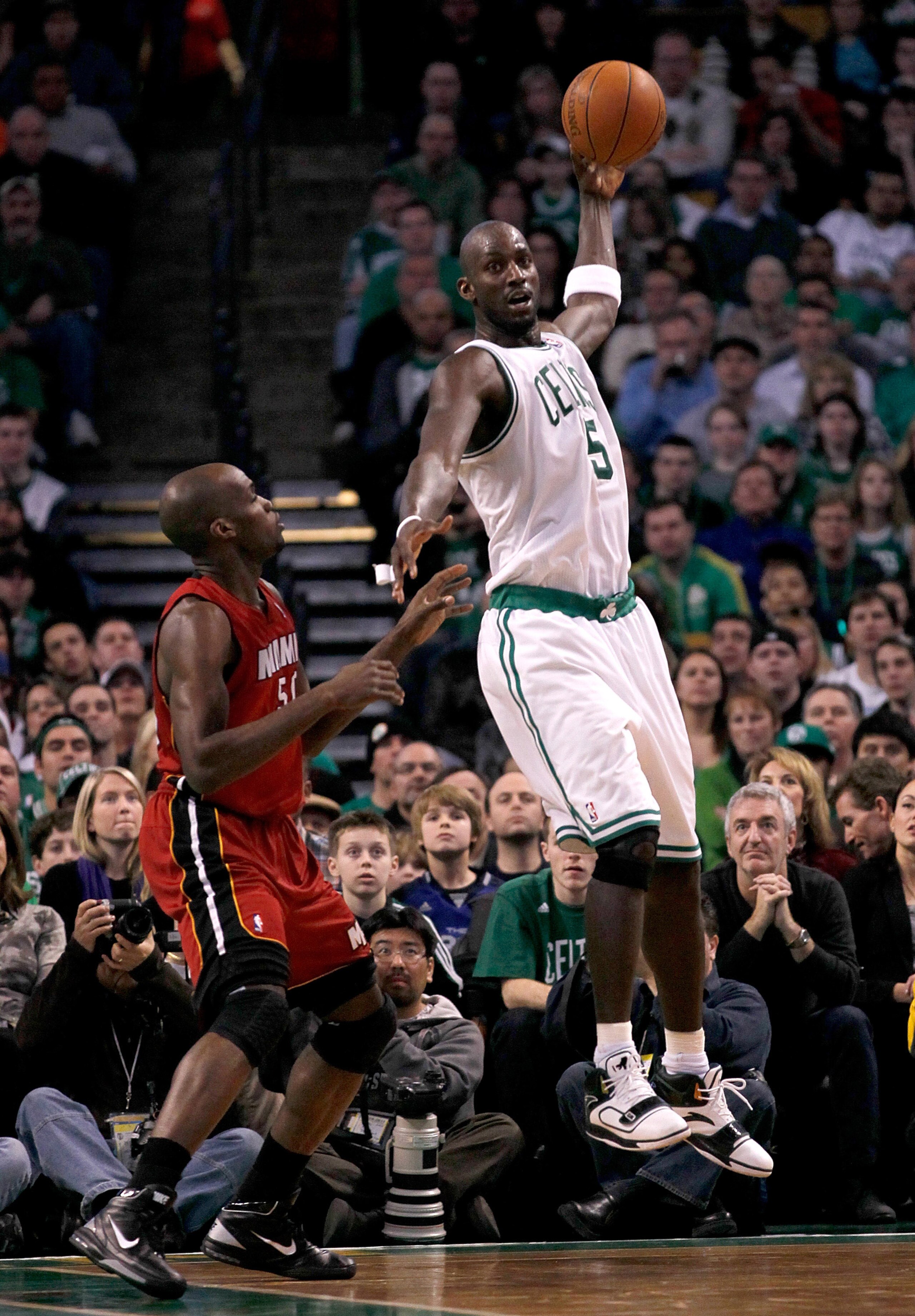 BOSTON - FEBRUARY 13: Kevin Garnett #5 of the Boston Celtics catches a pass against Joel Anthony #50 of the Miami Heat at TD Garden on February 13, 2011 in Boston, Massachusetts. The Celtics won 85-82. NOTE TO USER: User expressly acknowledges and agrees BOSTON - FEBRUARY 13: Kevin Garnett #5 of the Boston Celtics catches a pass against Joel Anthony #50 of the Miami Heat at TD Garden on February 13, 2011 in Boston, Massachusetts. The Celtics won 85-82. NOTE TO USER: User expressly acknowledges and agrees