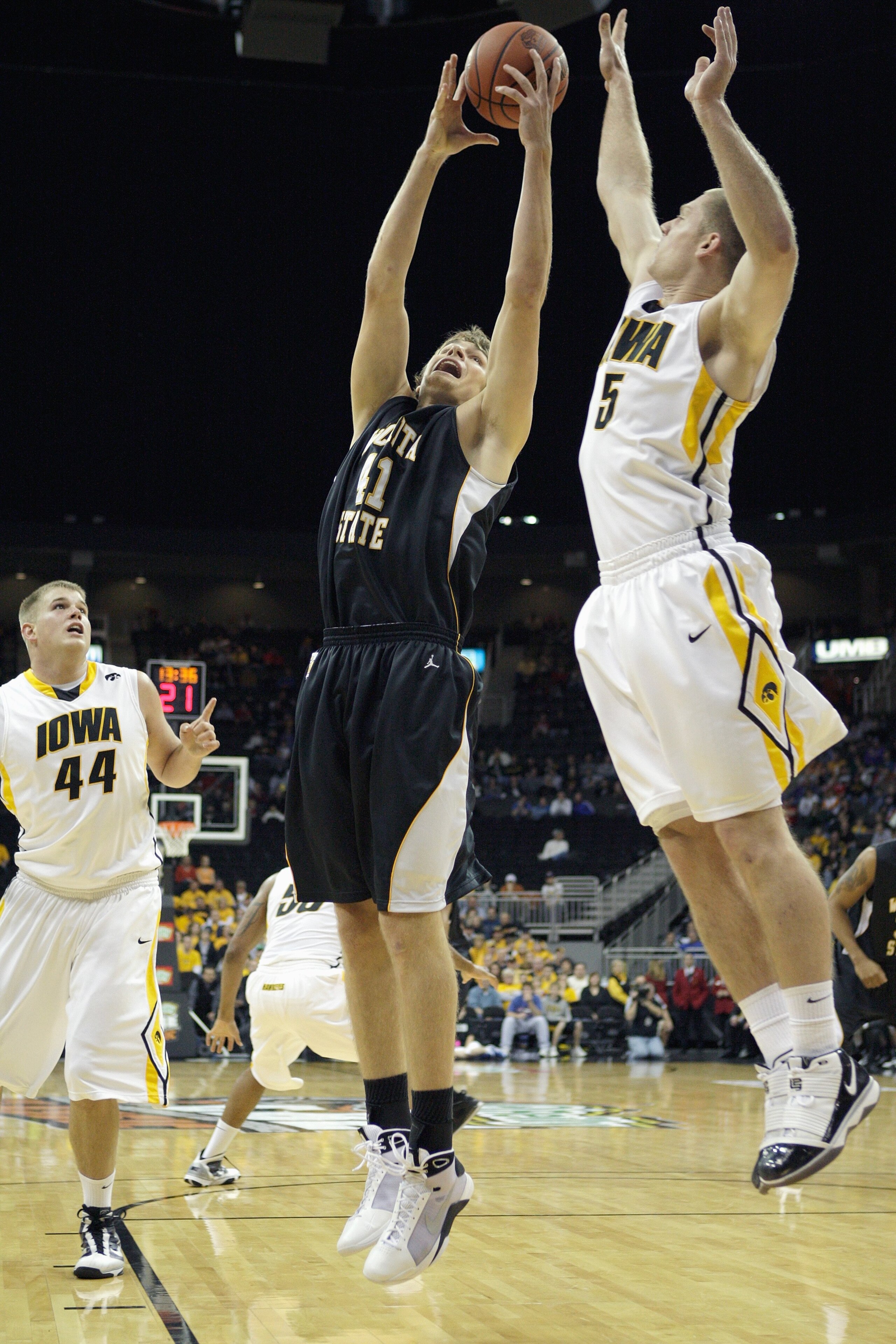 KANSAS CITY, MO - NOVEMBER 24: Garrett Stutz #41 of the Wichita State Shockers rebounds the ball against Matt Gatens #5 of the Iowa Hawkeyes during the CBE Classic consolation game on November 24, 2009 at Sprint Center in Kansas City, Missouri. (Photo by: