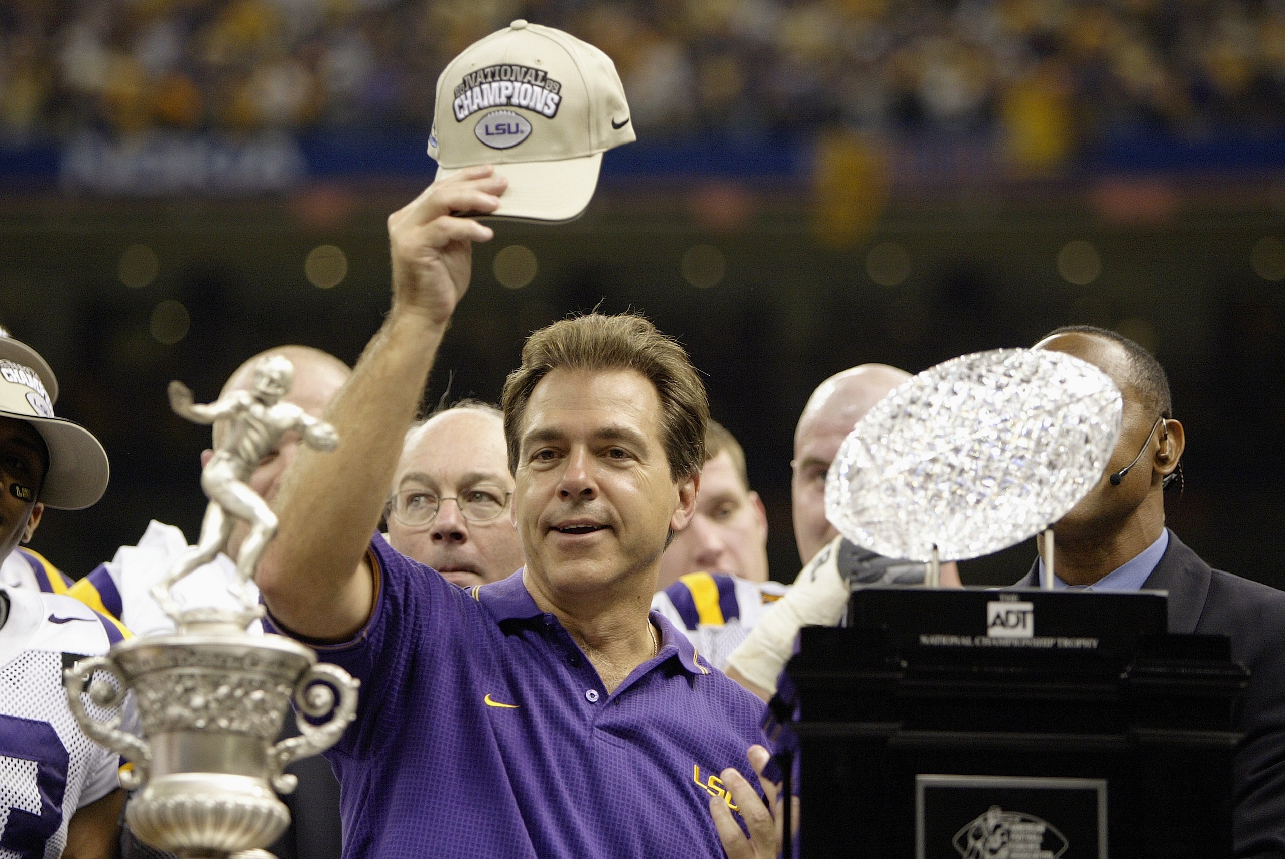 NEW ORLEANS - JANUARY 4:  Head coach Nick Saban of the Loiusiana State Tigers stands next to the Bowl Championship Series Trophy after his team defeated the Oklahoma Sooners in the Nokia Sugar Bowl National Championship on January 4, 2004 at the Louisiana
