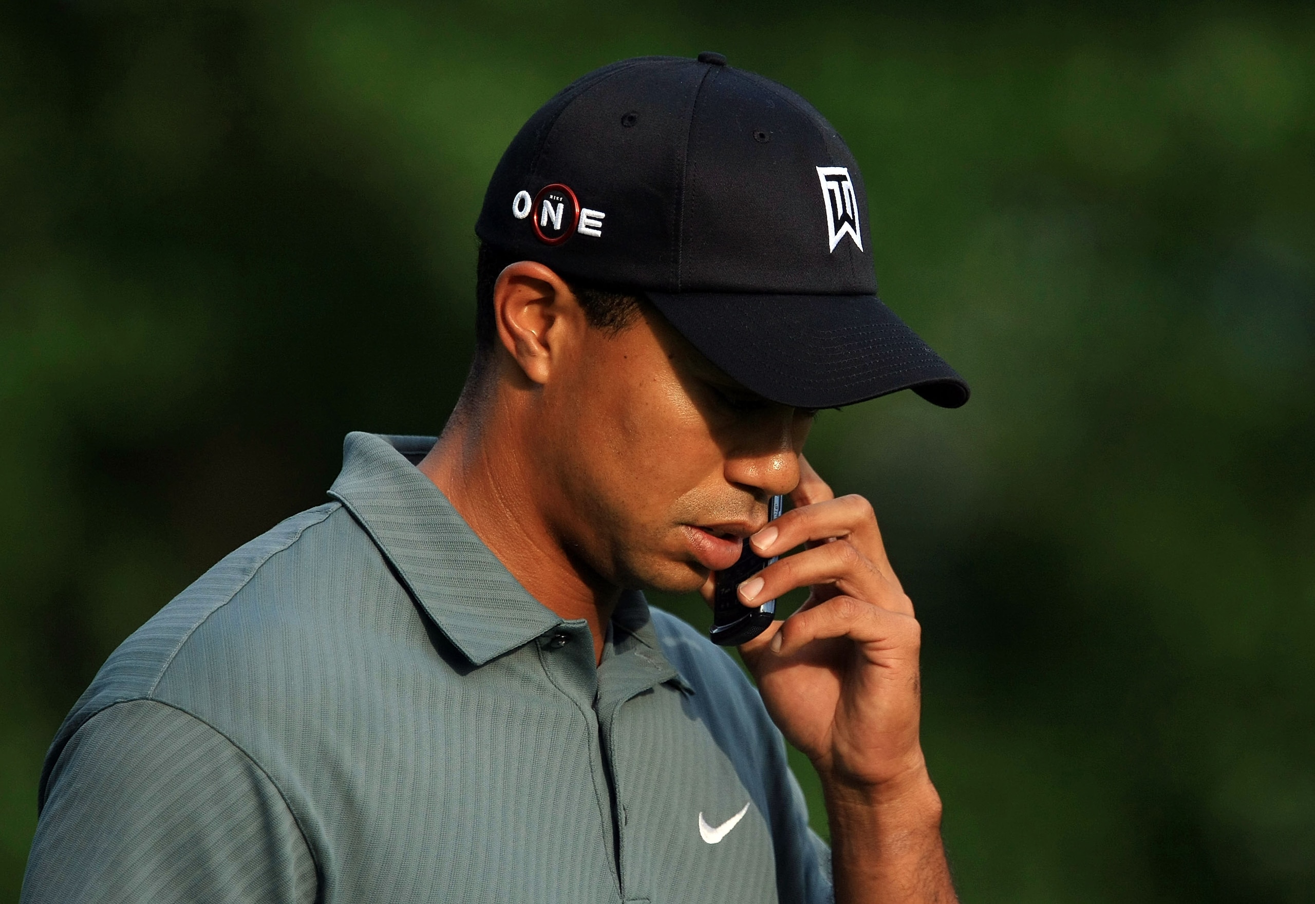 CHARLOTTE, NC - APRIL 29: Tiger Woods chats on a mobile phone during the Pro-Am prior to the start of the Quail Hollow Championship at the Quail Hollow Club on April 29, 2009 in Charlotte, North Carolina. (Photo by Scott Halleran/Getty Images) CHARLOTTE, NC - APRIL 29: Tiger Woods chats on a mobile phone during the Pro-Am prior to the start of the Quail Hollow Championship at the Quail Hollow Club on April 29, 2009 in Charlotte, North Carolina. (Photo by Scott Halleran/Getty Images)