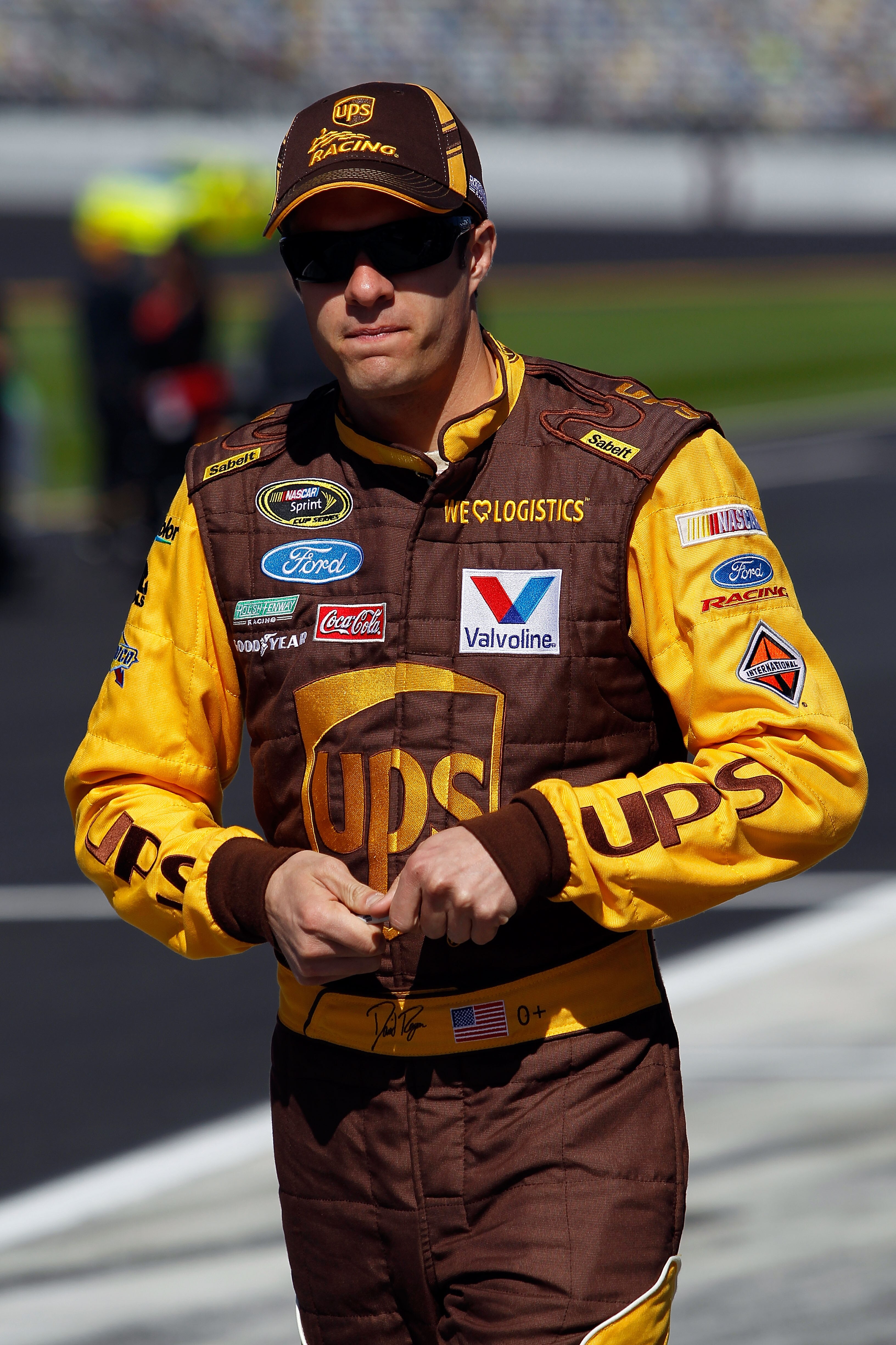 DAYTONA BEACH, FL - FEBRUARY 13:  David Ragan, driver of the #6 UPS Ford, walks on pit road during qualifying for the NASCAR Sprint Cup Series Daytona 500 at Daytona International Speedway on February 13, 2011 in Daytona Beach, Florida.  (Photo by Tom Pen