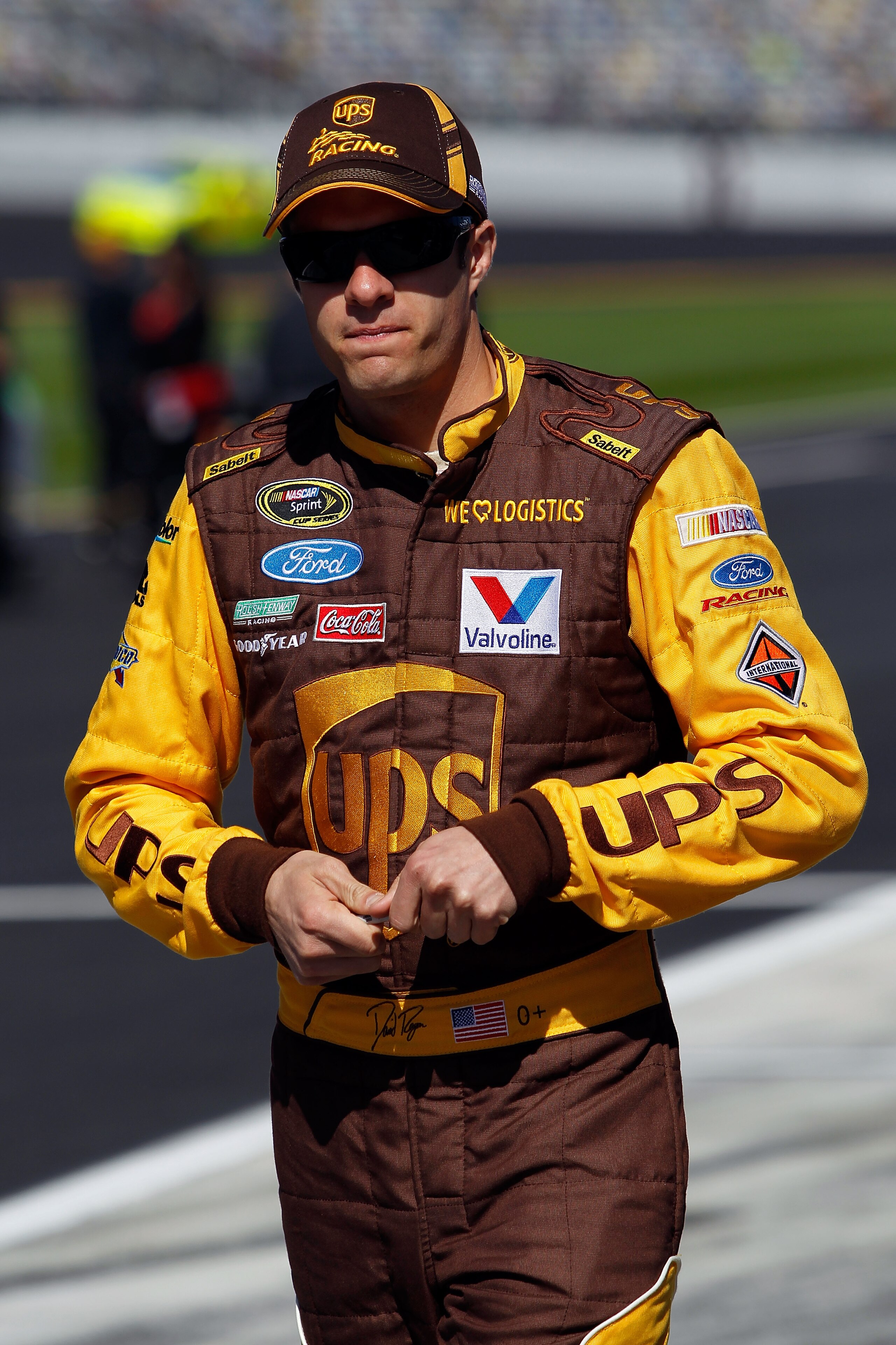 DAYTONA BEACH, FL - FEBRUARY 13:  David Ragan, driver of the #6 UPS Ford, walks on pit road during qualifying for the NASCAR Sprint Cup Series Daytona 500 at Daytona International Speedway on February 13, 2011 in Daytona Beach, Florida.  (Photo by Tom Pen