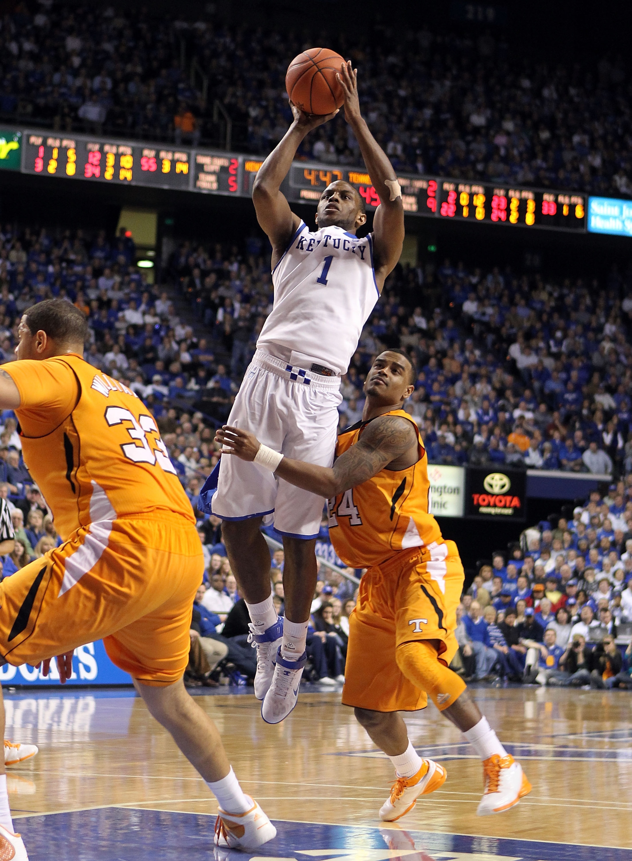 LEXINGTON, KY - FEBRUARY 08: Darius Miller #1 of the Kentucky Wildcats shoots the ball while defended by Josh Bone #24 of the Tennessee Volunteers during the SEC game at Rupp Arena on February 8, 2011 in Lexington, Kentucky. Kentucky won 73-61.  (Photo by