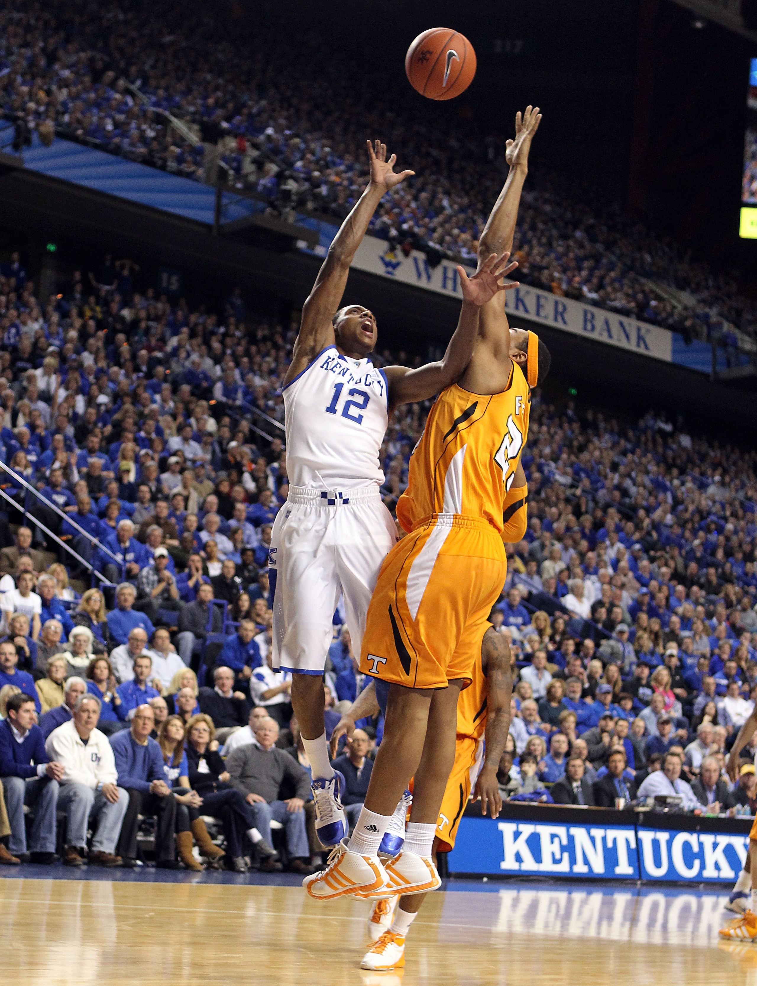 LEXINGTON, KY - FEBRUARY 08:  Brandon Knight #12 of the Kentucky Wildcats shoots the ball while defended by John Fields #25 of the Tennessee Volunteers during the SEC game at Rupp Arena on February 8, 2011 in Lexington, Kentucky. Kentucky won 73-61.  (Pho